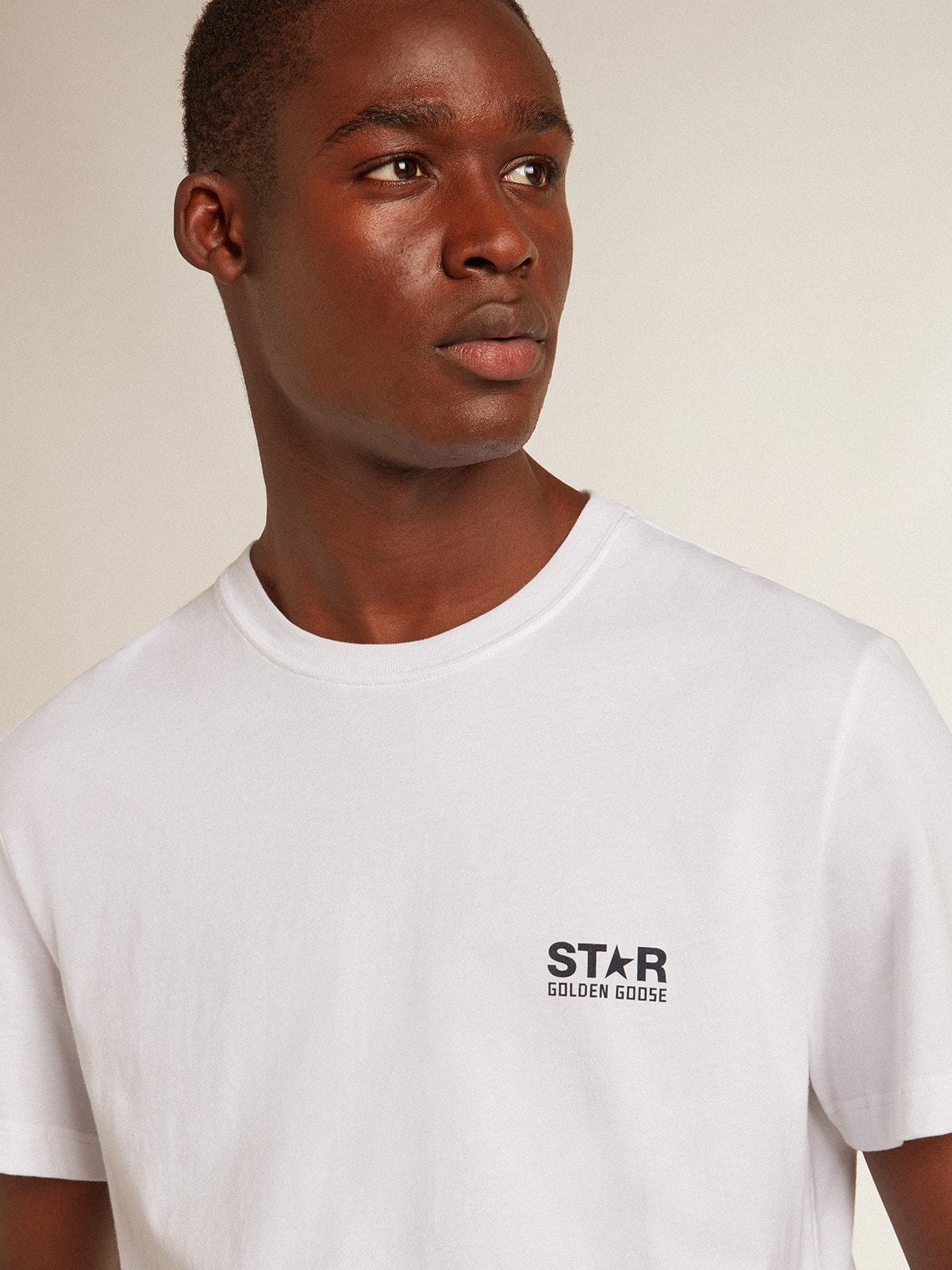 Men's white T-shirt with dark blue star on the back