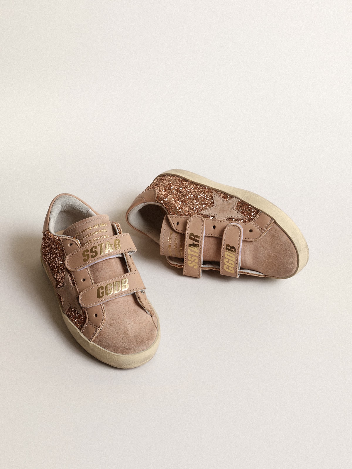 Old School Young in peach-pink glitter with pink suede star