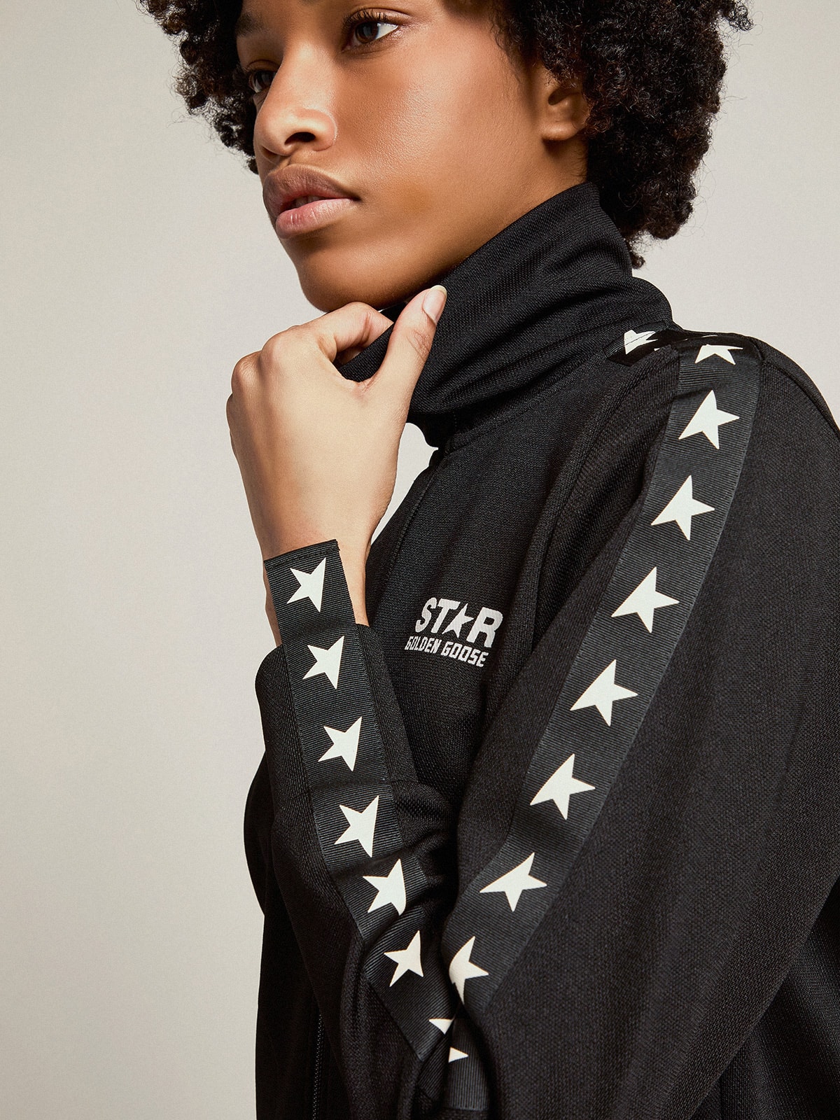Women's black zipped sweatshirt with white stars