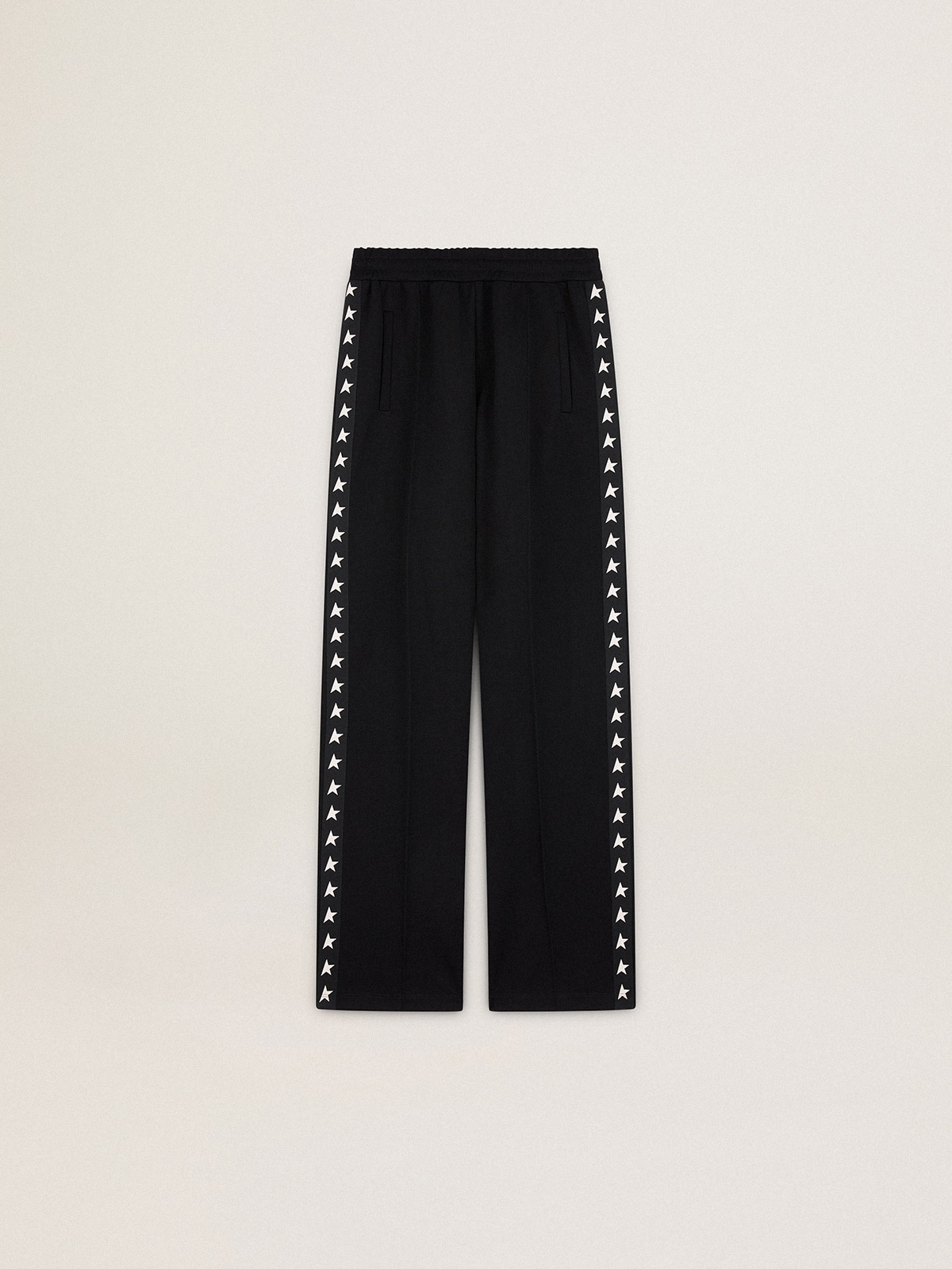 Women's black joggers with white stars on the sides
