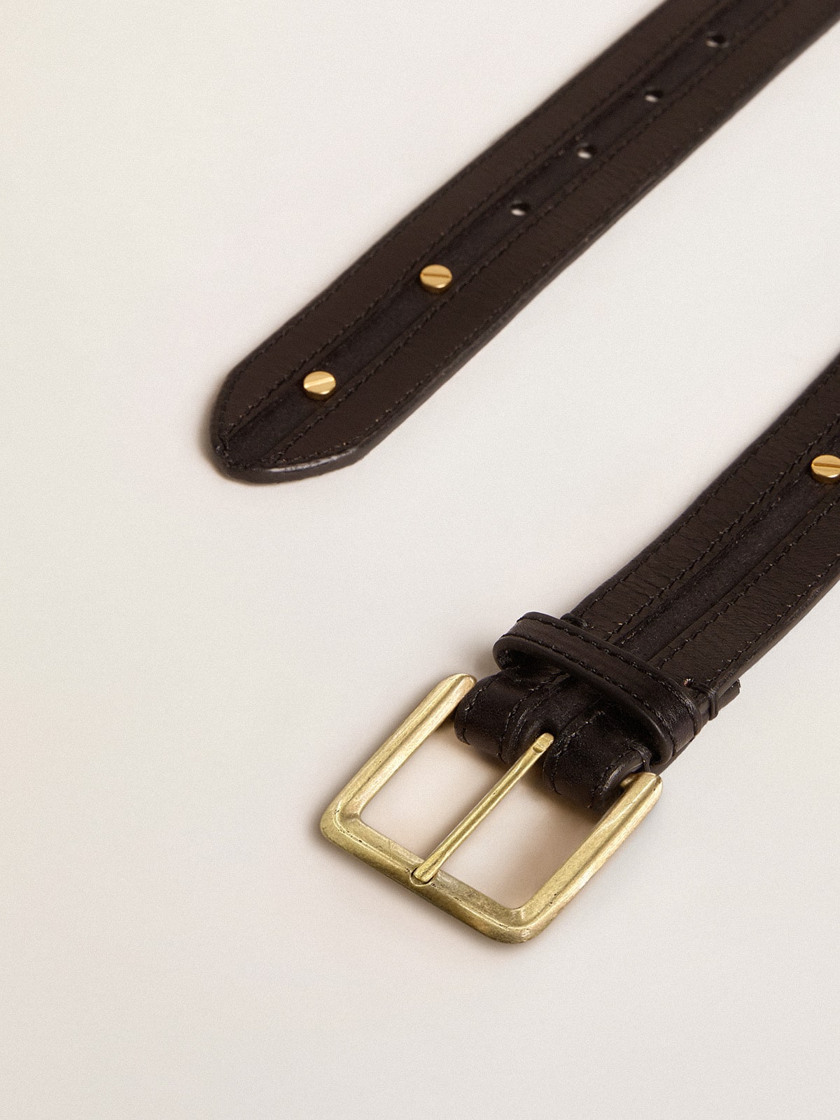 Women's black belt in washed leather with gold studs