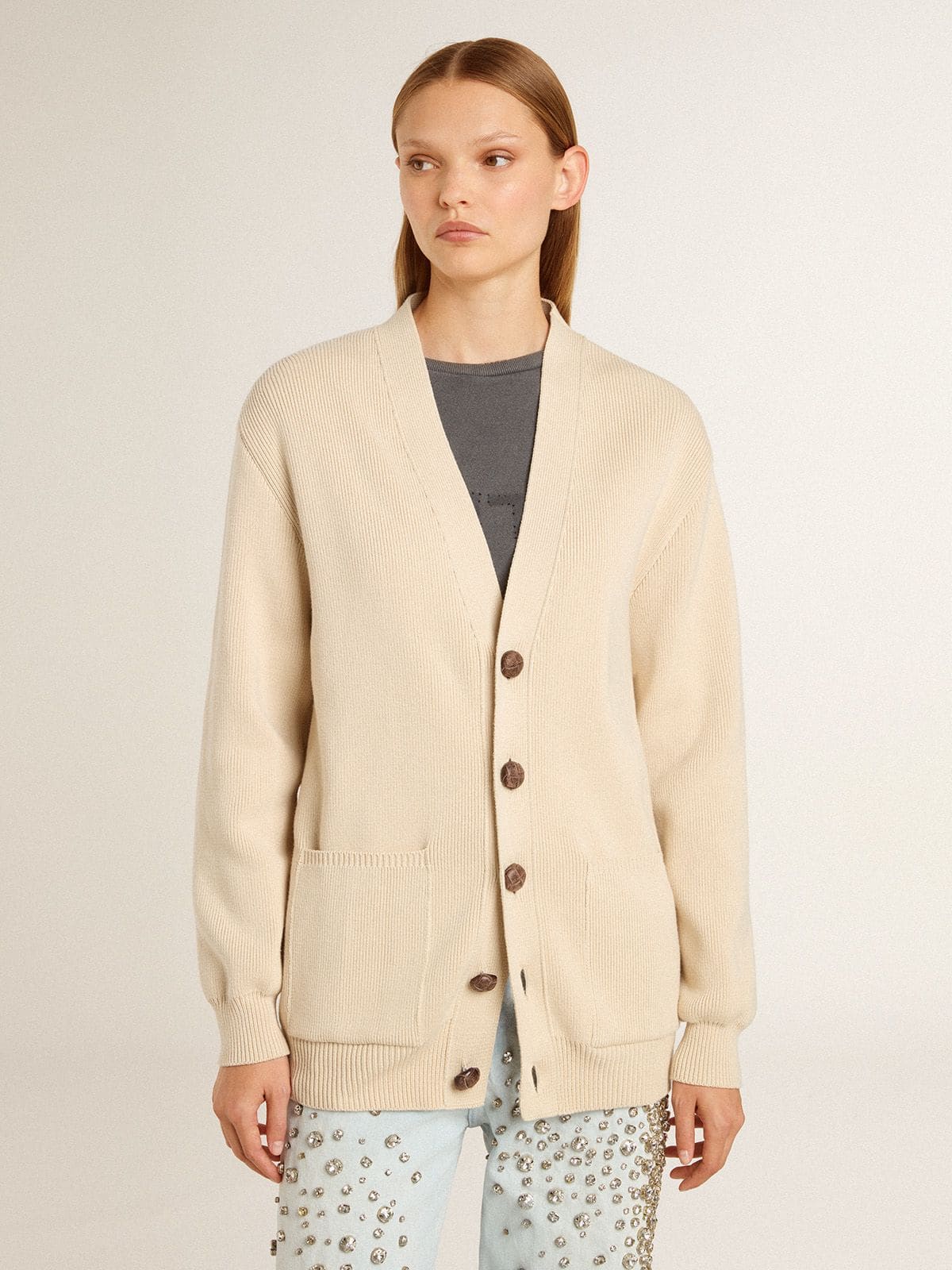 Women's beige cardigan with 'Golden' lettering on the back