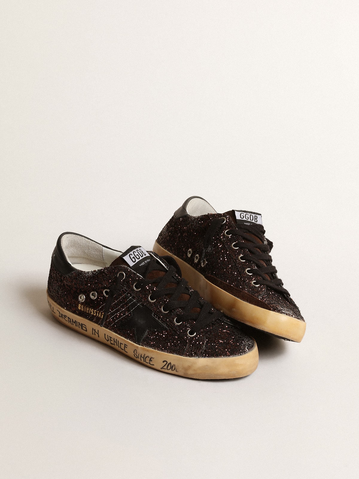 Super-Star in brown glitter with black leather star and heel tab