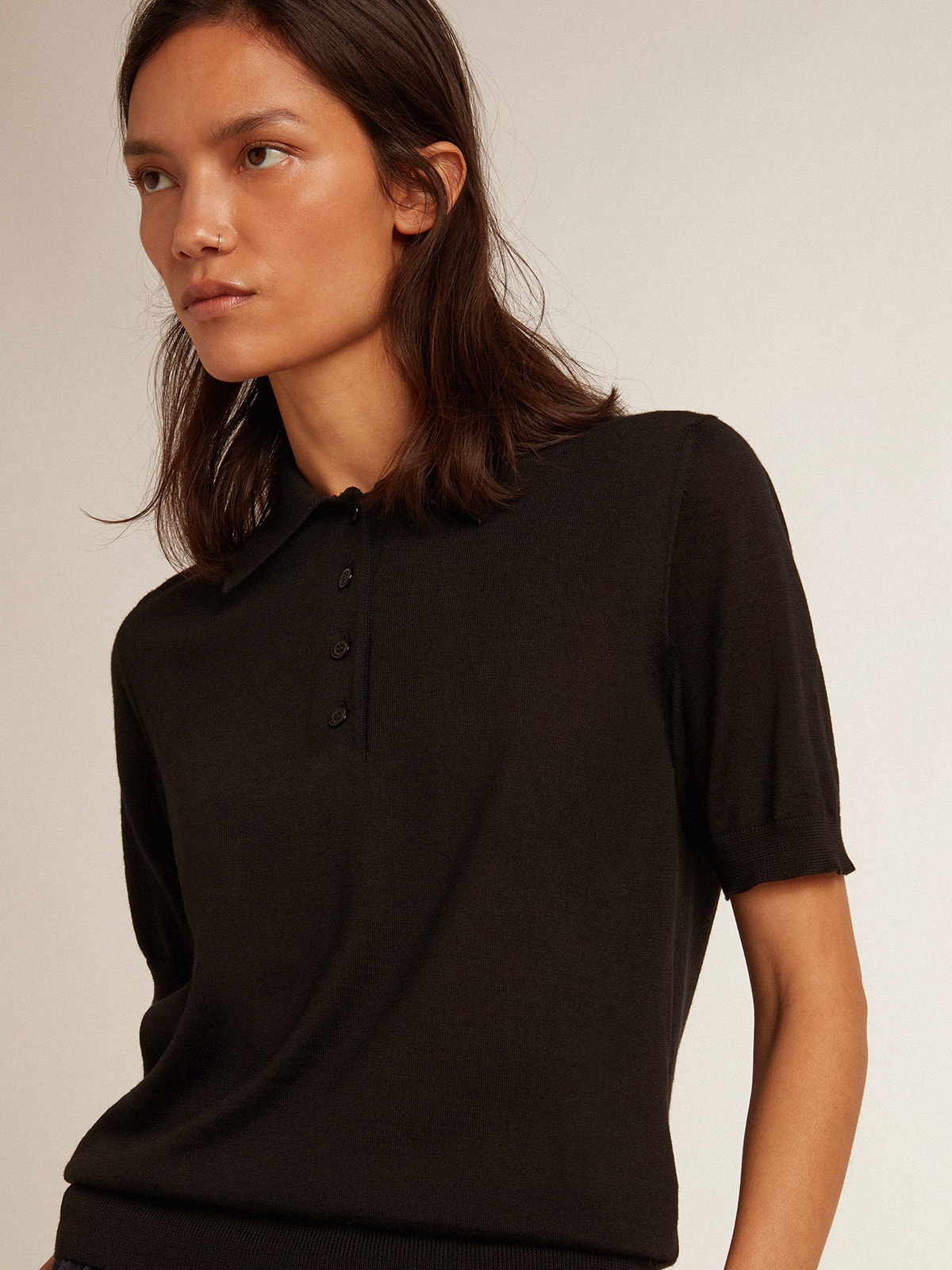 Women's polo shirt in black merino wool