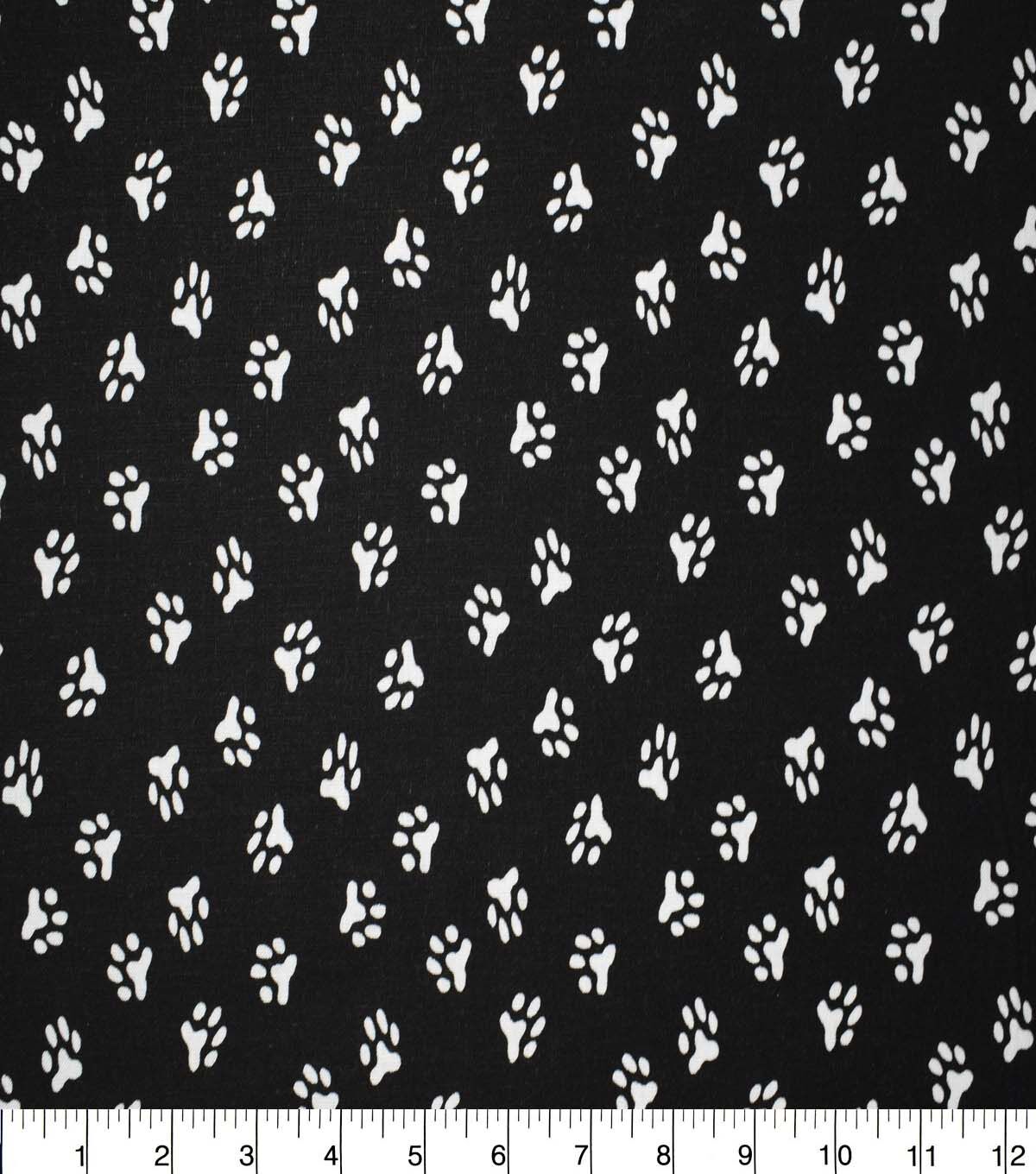 Paw Prints on Black Cotton Fabric by Quilter's Showcase