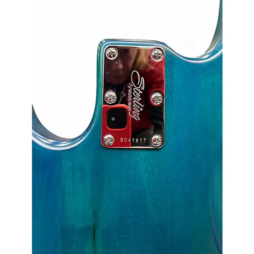 Used Sterling by Music Man Ray34 trans tunq Electric Bass Guitar trans tunq