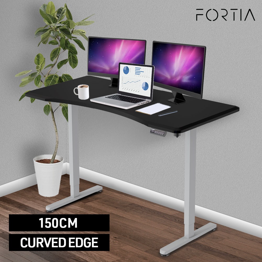 FORTIA Sit To Stand Up Standing Desk, 150x68cm, 72-118cm Electric Height Adjustable, Ergonomically Curved Edge, 50kg Rated, Black/Silver Frame