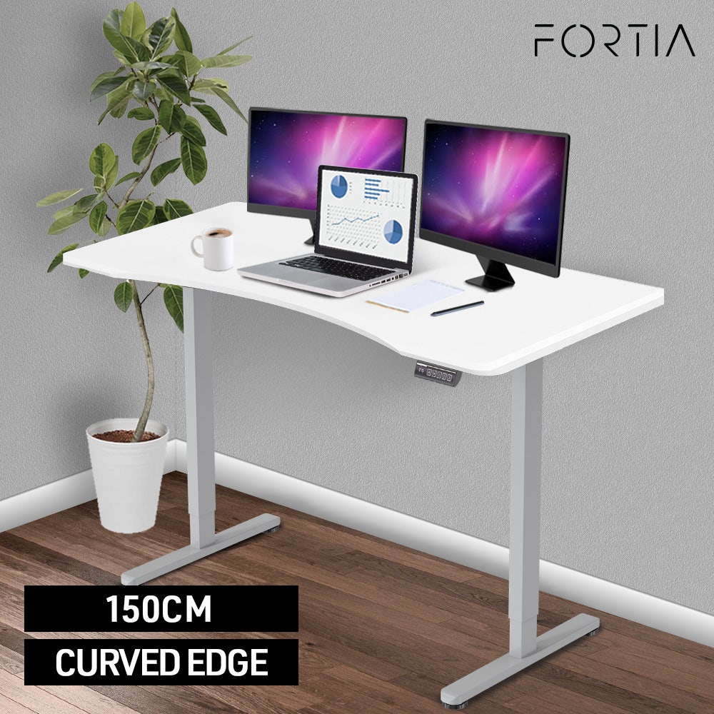 FORTIA Sit To Stand Up Standing Desk, 150x68cm, 72-118cm Electric Height Adjustable, Ergonomically Curved Edge, 50kg Rated, White/Silver Frame