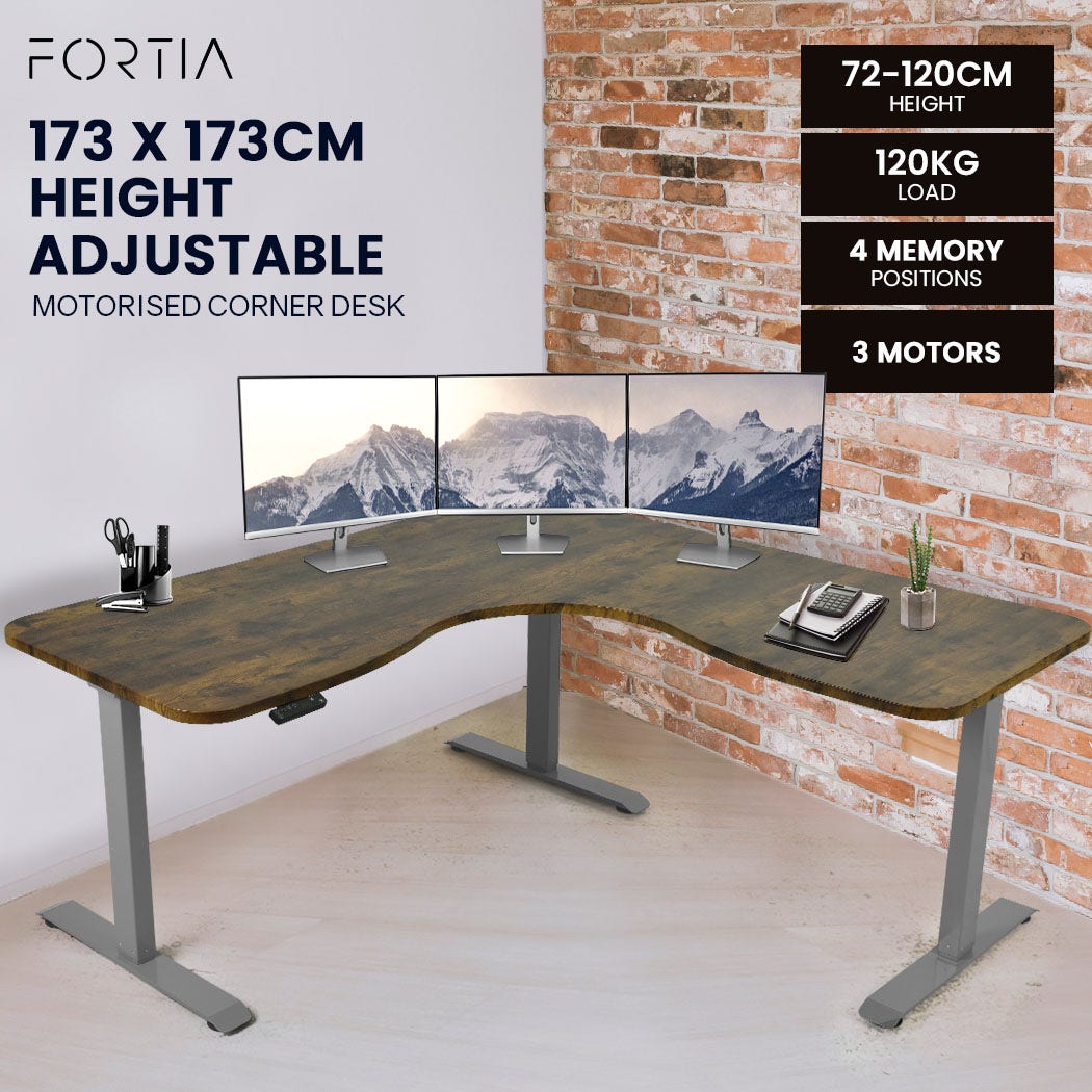 FORTIA Corner Standing Desk, 1730W x 1730W x 750D, 3 Motors, 120kg Load, Sit to Stand Up Electric Height Adjustable, Walnut/Silver Frame