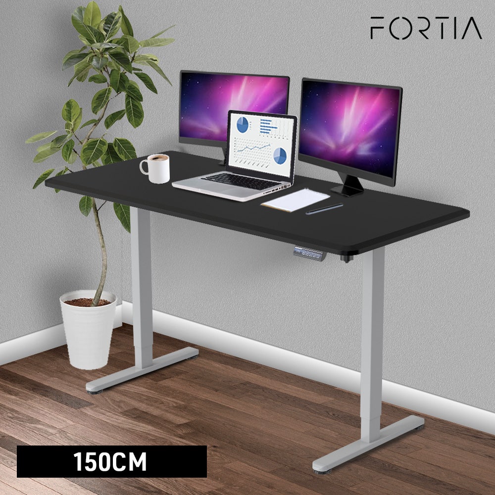 FORTIA Sit To Stand Up Standing Desk, 150x68cm, 72-118cm Electric Height Adjustable, 50kg Rated, Black/Silver Frame