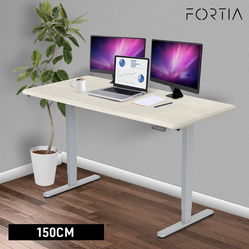 FORTIA Sit To Stand Up Standing Desk, 150x68cm, 72-118cm, Height Adjustable, 50kg Rated, White Oak Style/Silver Frame