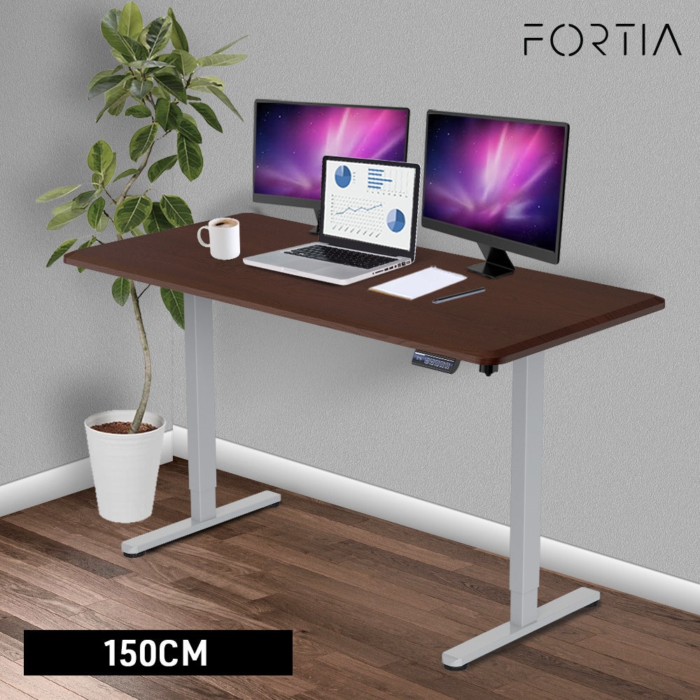 FORTIA Sit To Stand Up Standing Desk, 150x68cm, 72-118cm, Height Adjustable, 50kg Rated, Walnut Style/Silver Frame