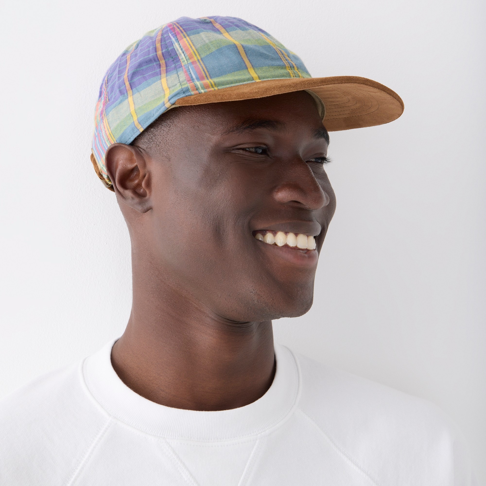 Baseball cap in plaid with suede brim