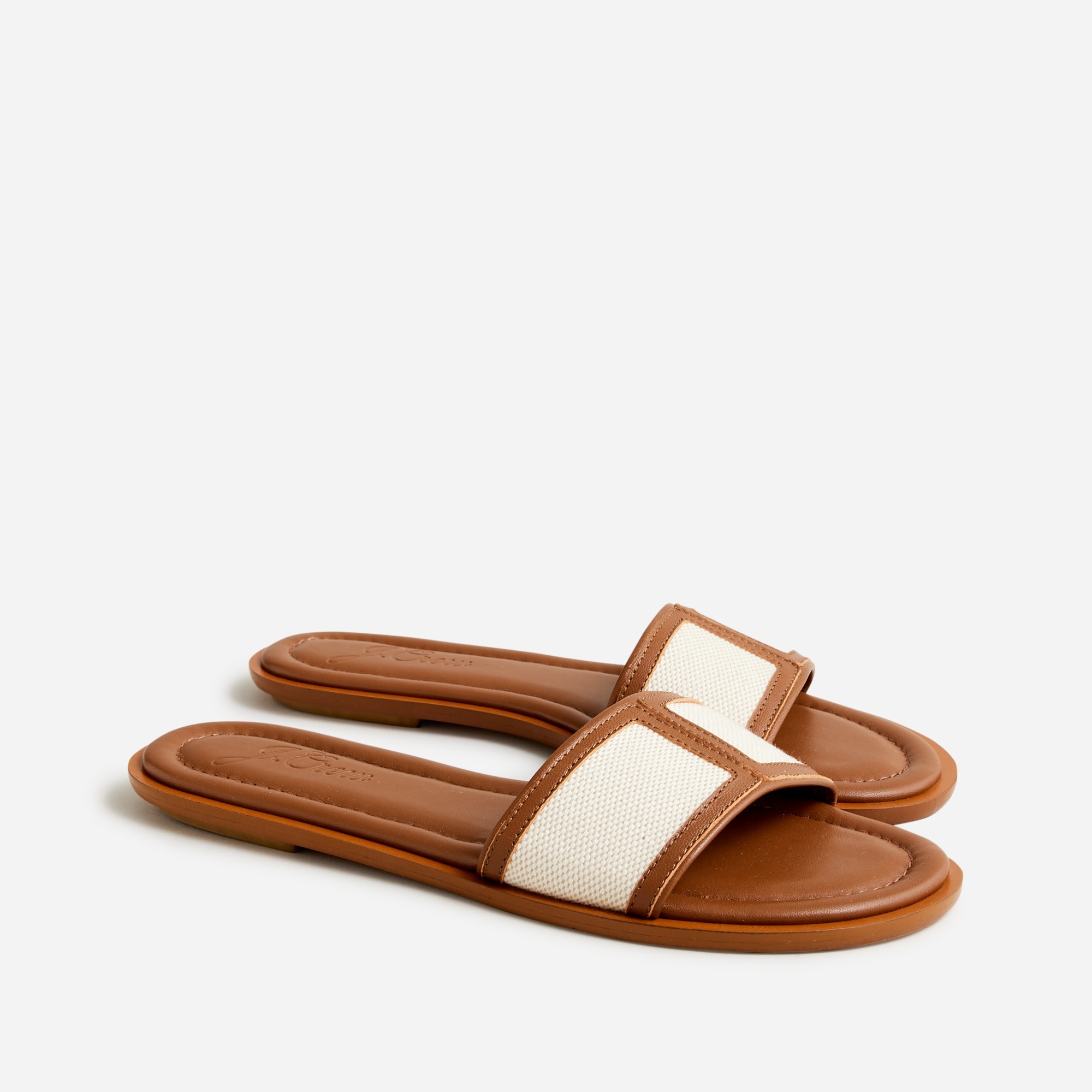 Slide sandals in canvas and leather
