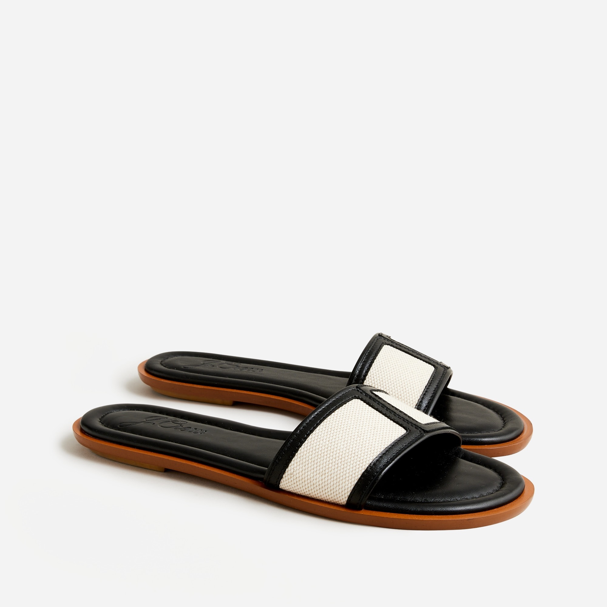 Slide sandals in canvas and leather