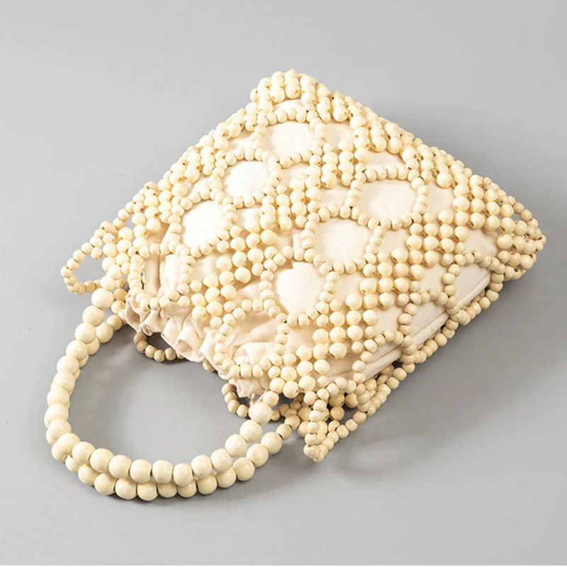 Buddha Stones Hand-woven Round Hollow Wooden Beads Handbag