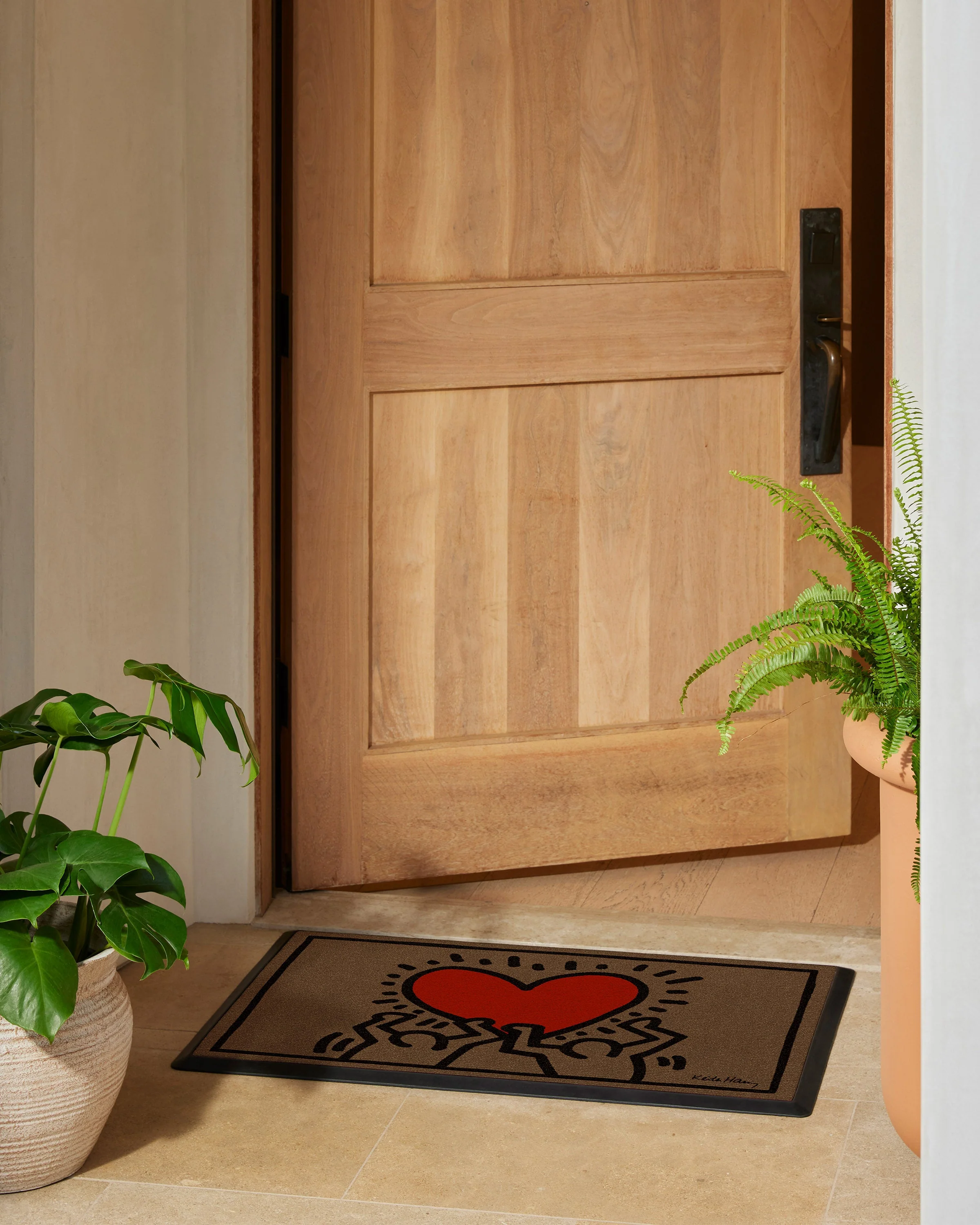 Holding Heart Doormat by Keith Haring