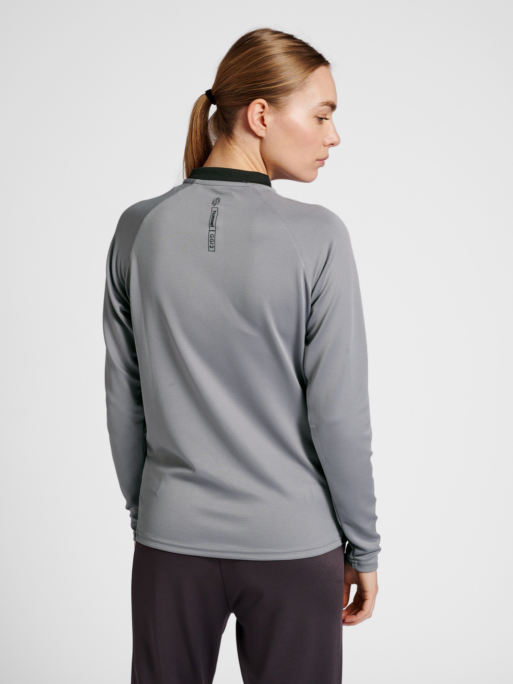 hmlGG12 ACTION HALF ZIP SWEAT WOMAN