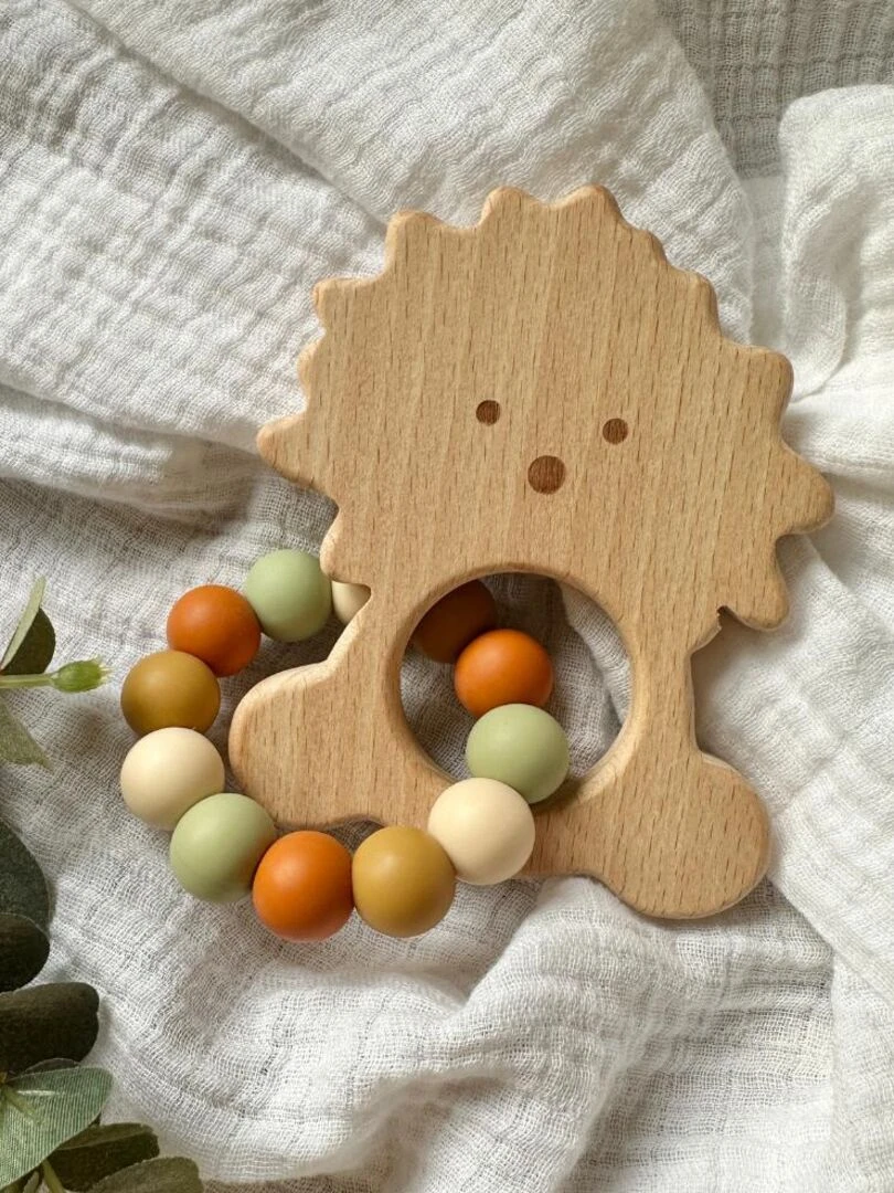 Hochet lion bois et silicone Orange