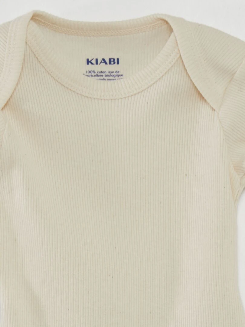 7 bodies unis + pochon de rangement   Beige