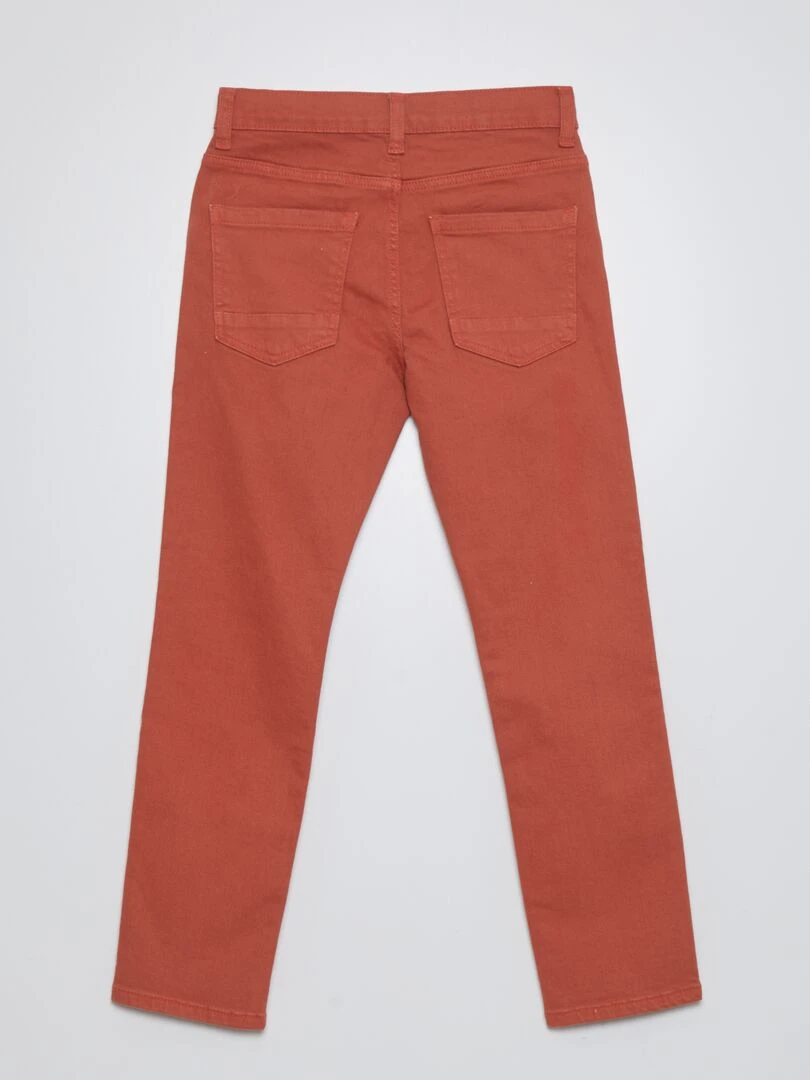 Jean slim à 5 poches rouge brique