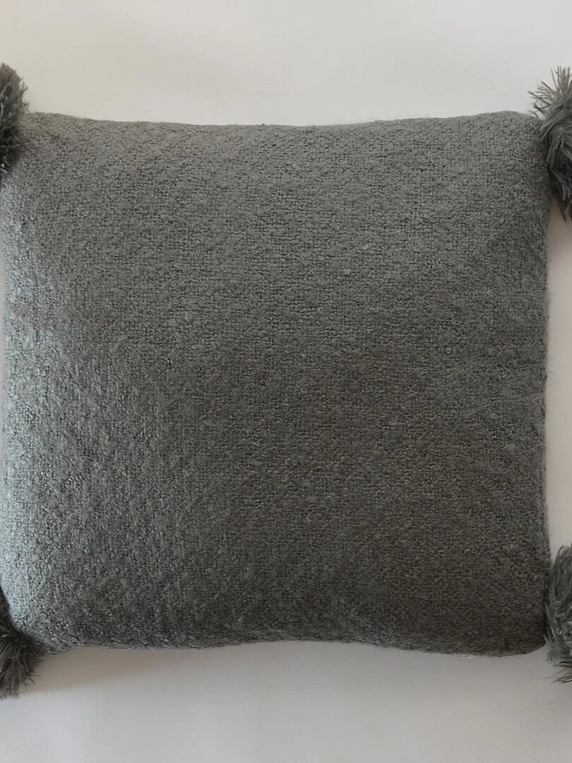 Coussin Effet laineux à pompons gris anthracite