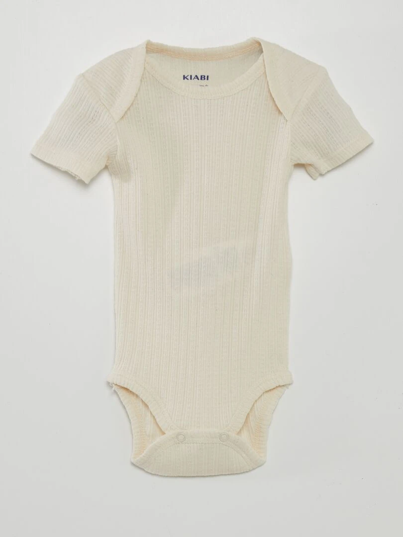 7 bodies unis + pochon de rangement   Beige