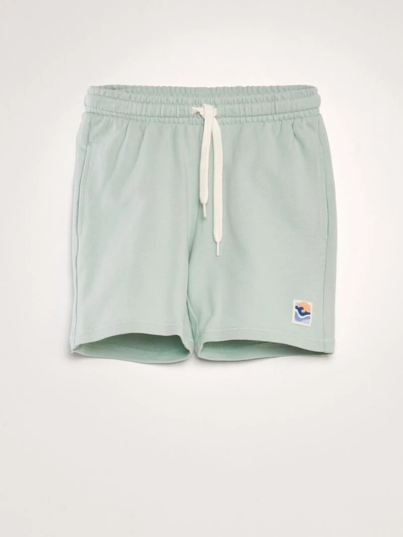 Bermuda en french terry style surf Vert