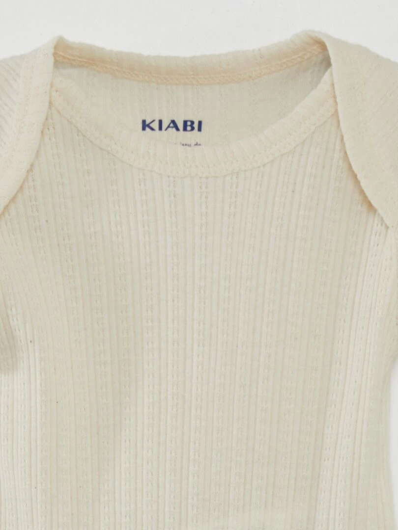 7 bodies unis + pochon de rangement   Beige