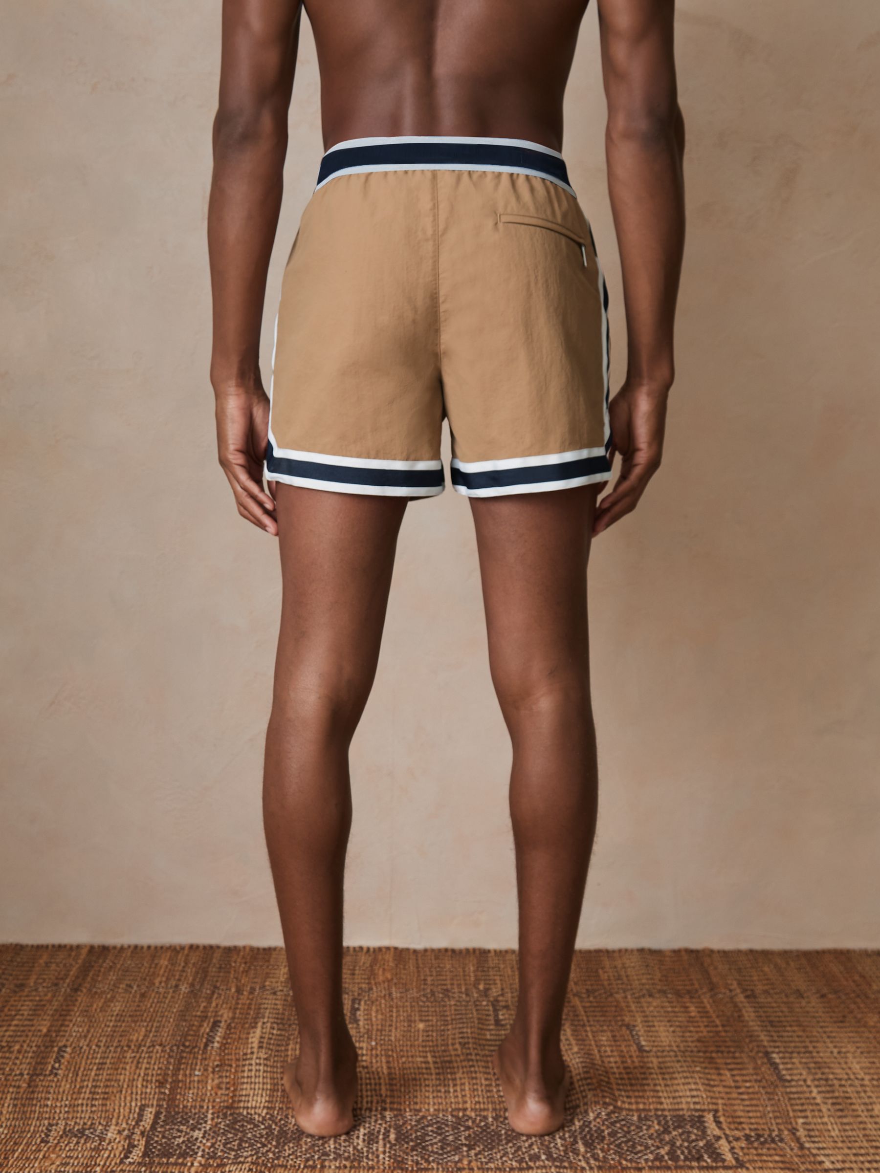 Reiss | Ché Stripe-Trim Swim Shorts in Camel