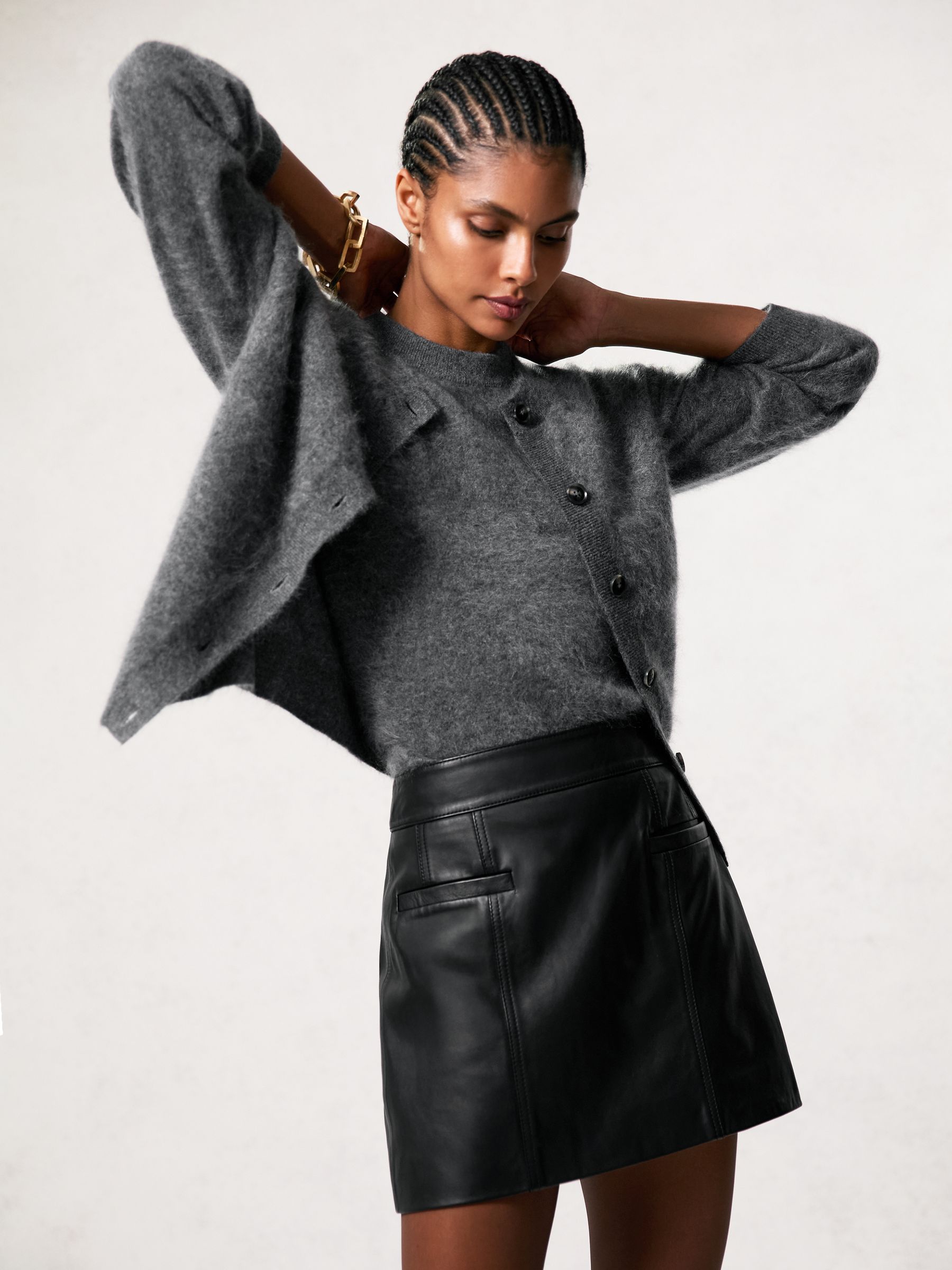 Leather Welt-Pocket Mini Skirt in Black