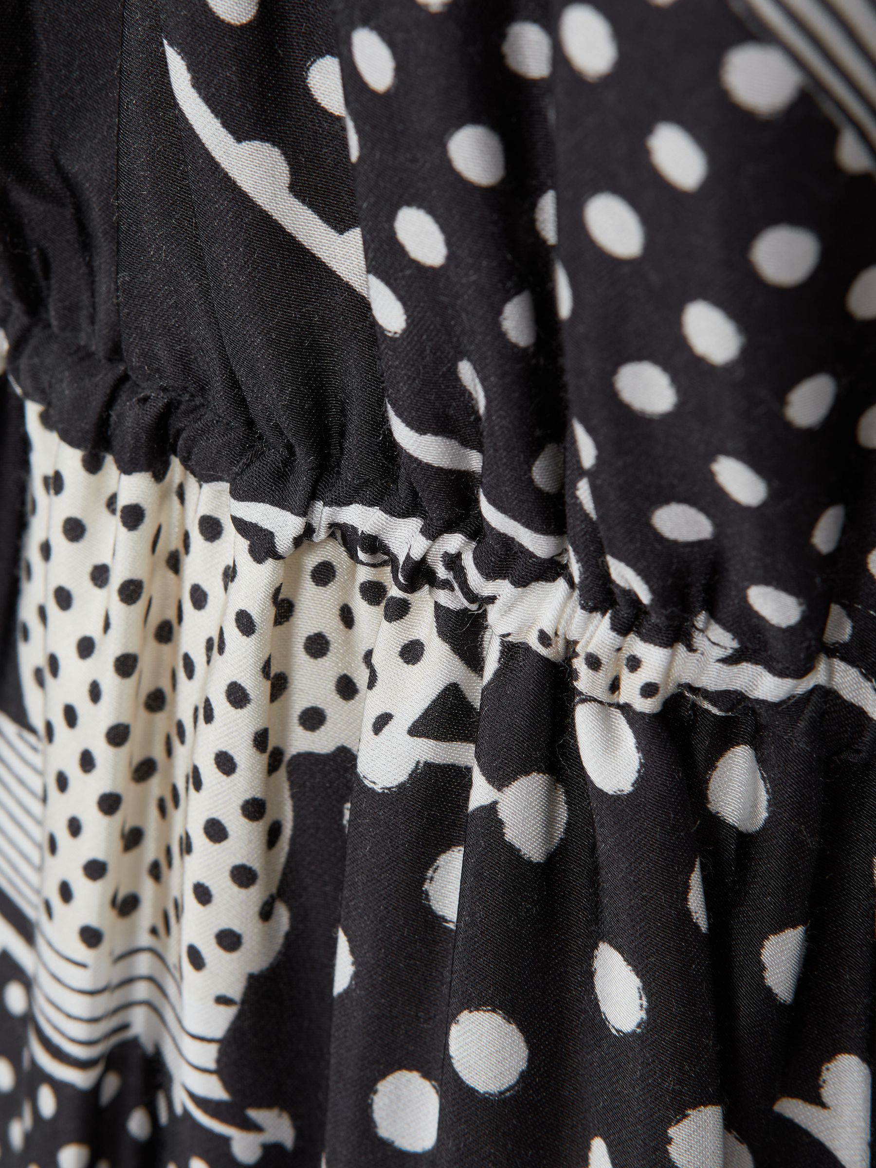 Florere Polka Dot Puff Sleeve Mini Dress in Black