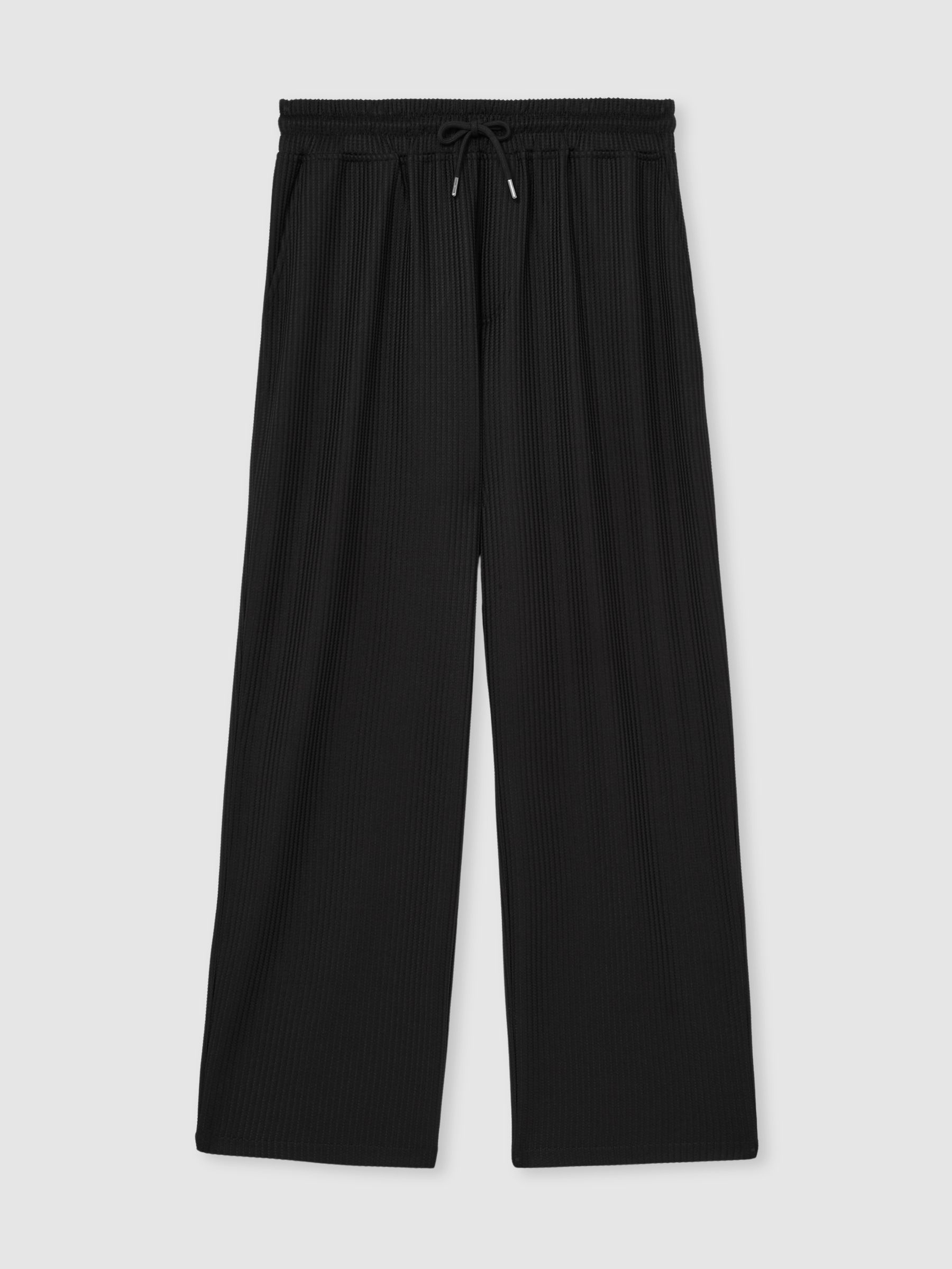 Textured-Knit Tapered Trousers in Black