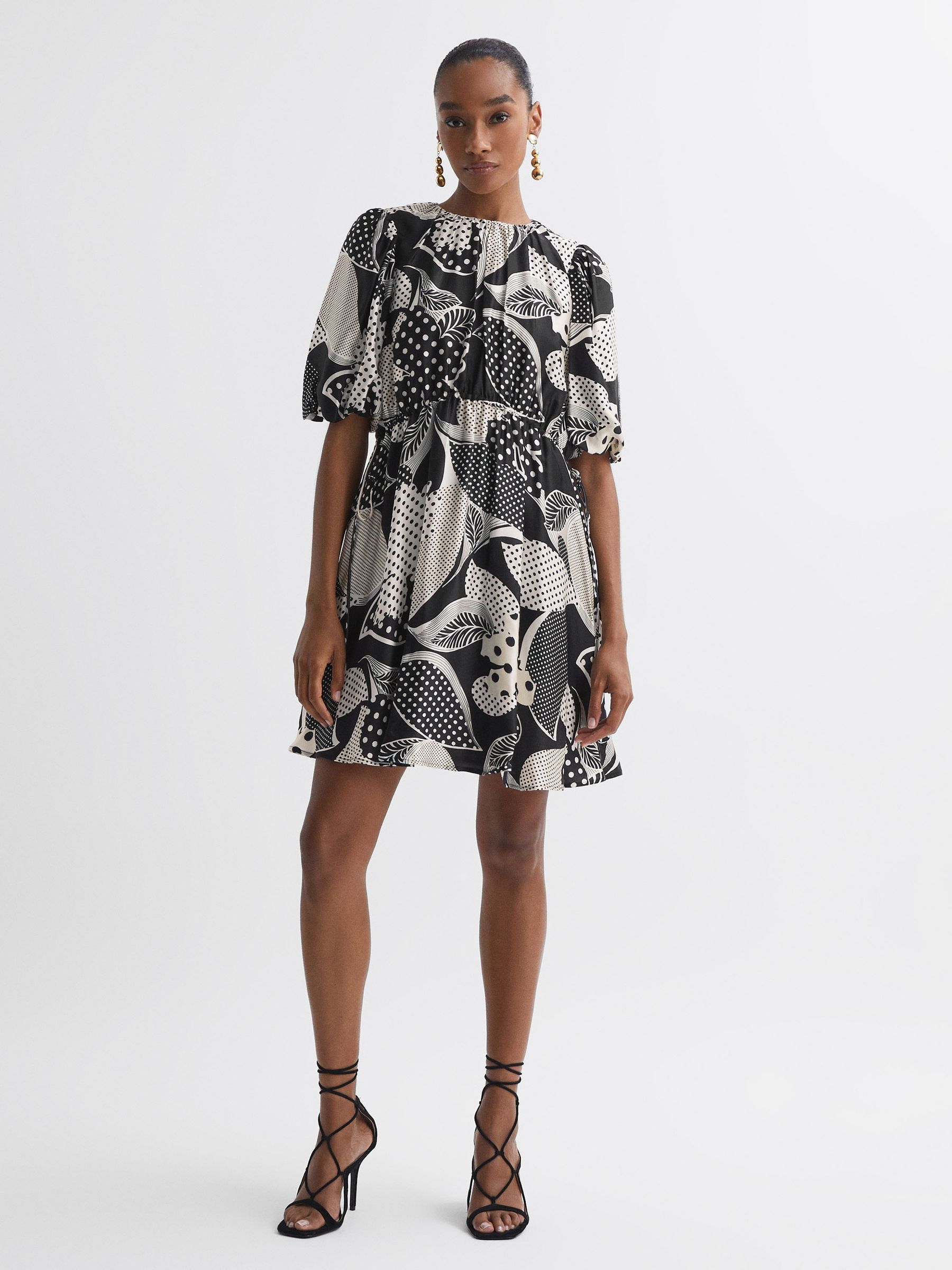 Florere Polka Dot Puff Sleeve Mini Dress in Black