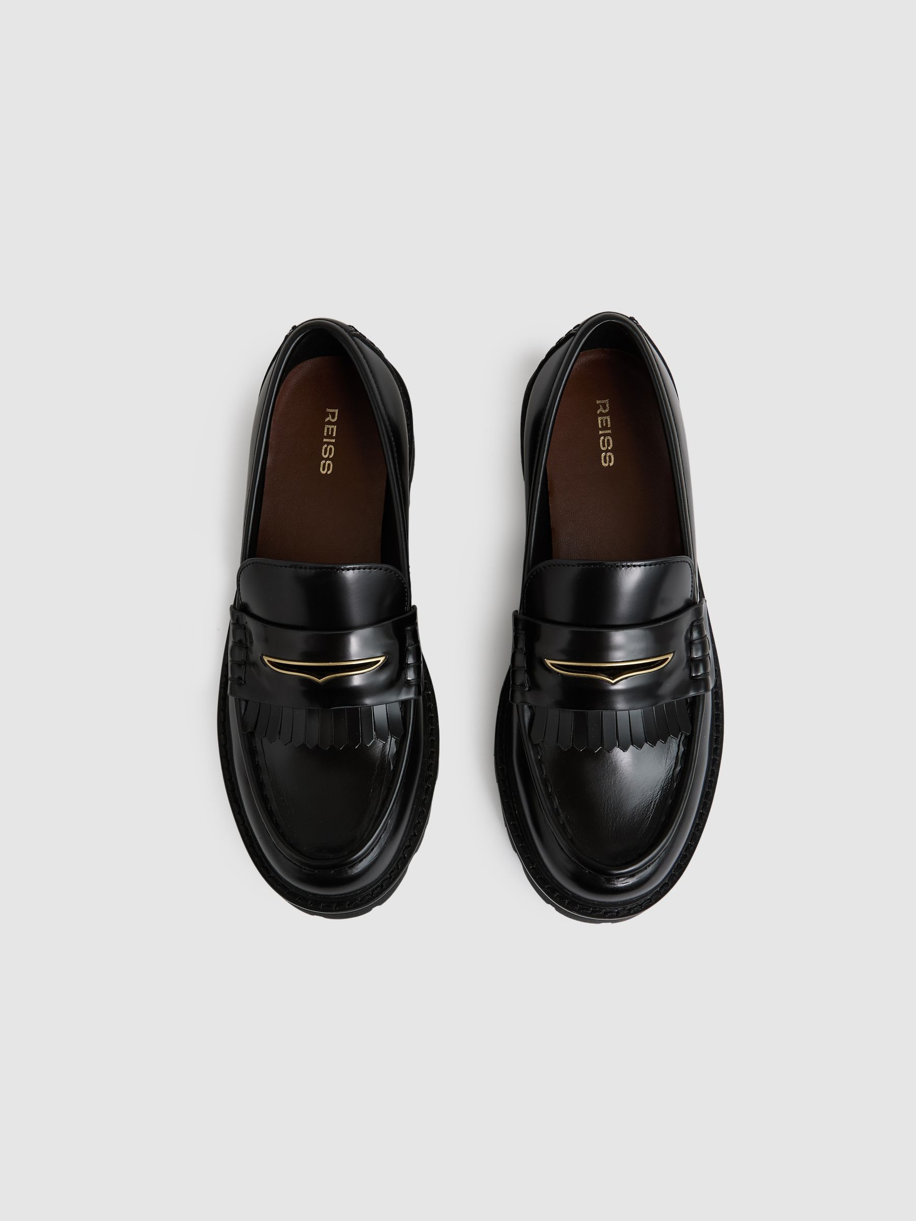 Leather Fringed Chunky Penny Loafers in Black
