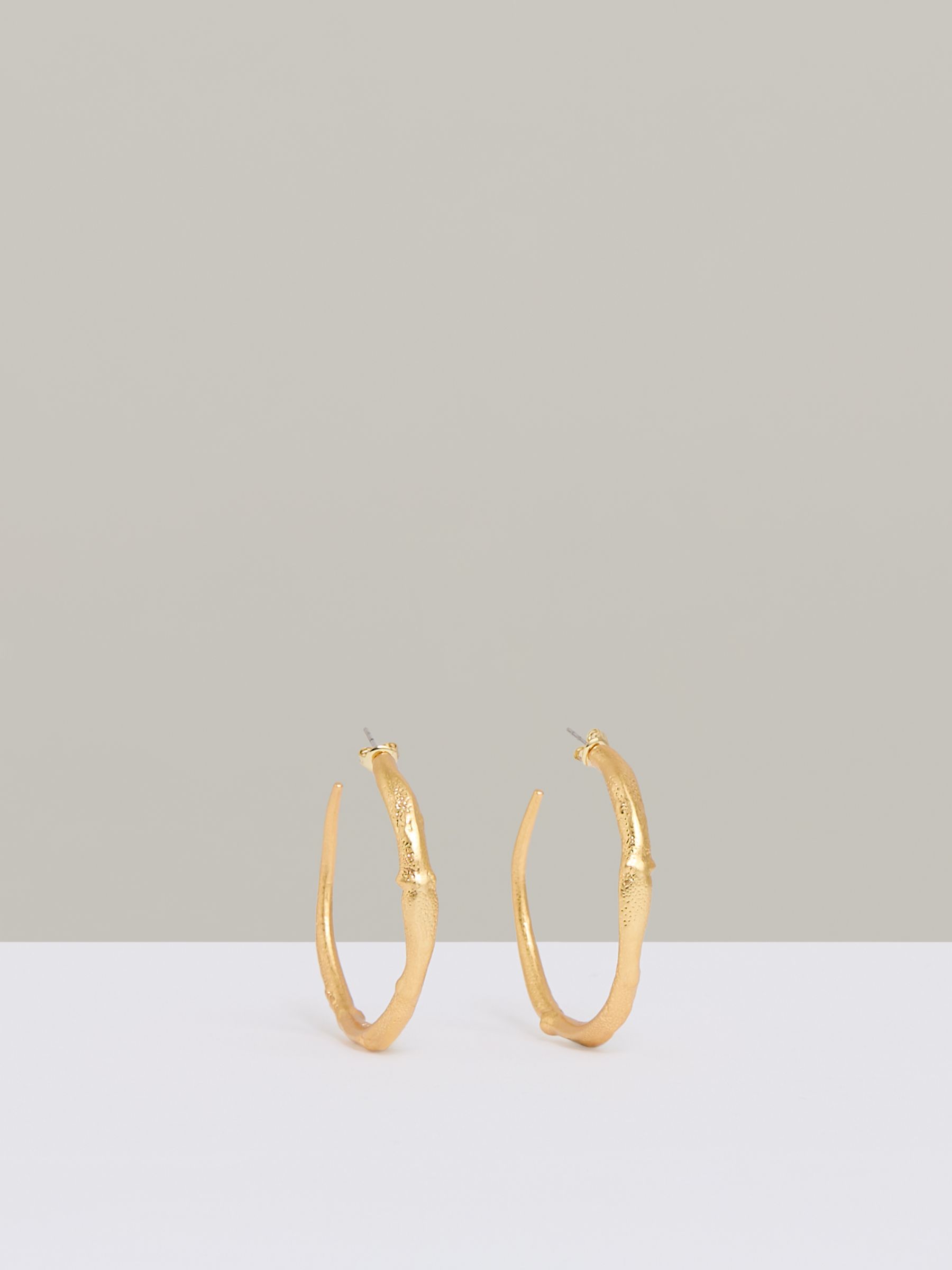 Molten Hoop Earrings in Gold Tone