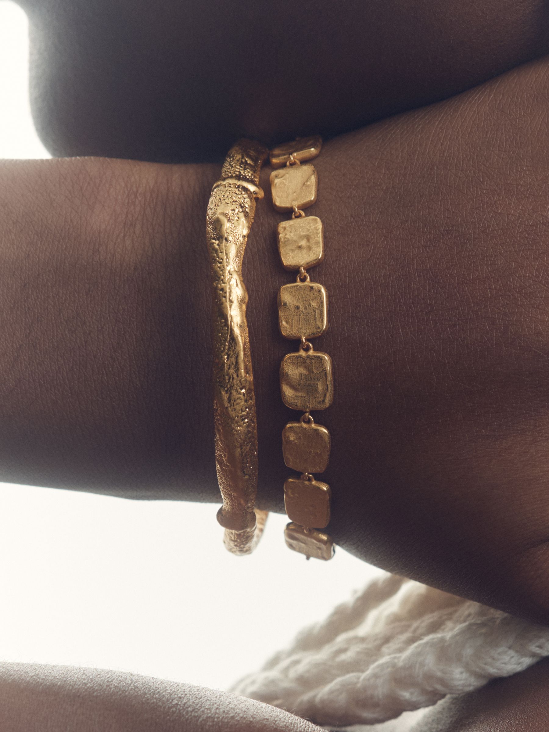 Molten Curve Bangle in Gold Tone