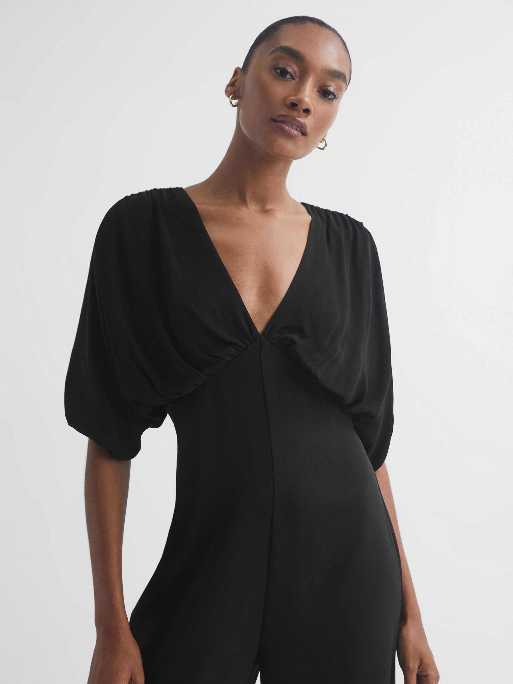 Florere Plunge Neck Wide Leg Jumpsuit in Black