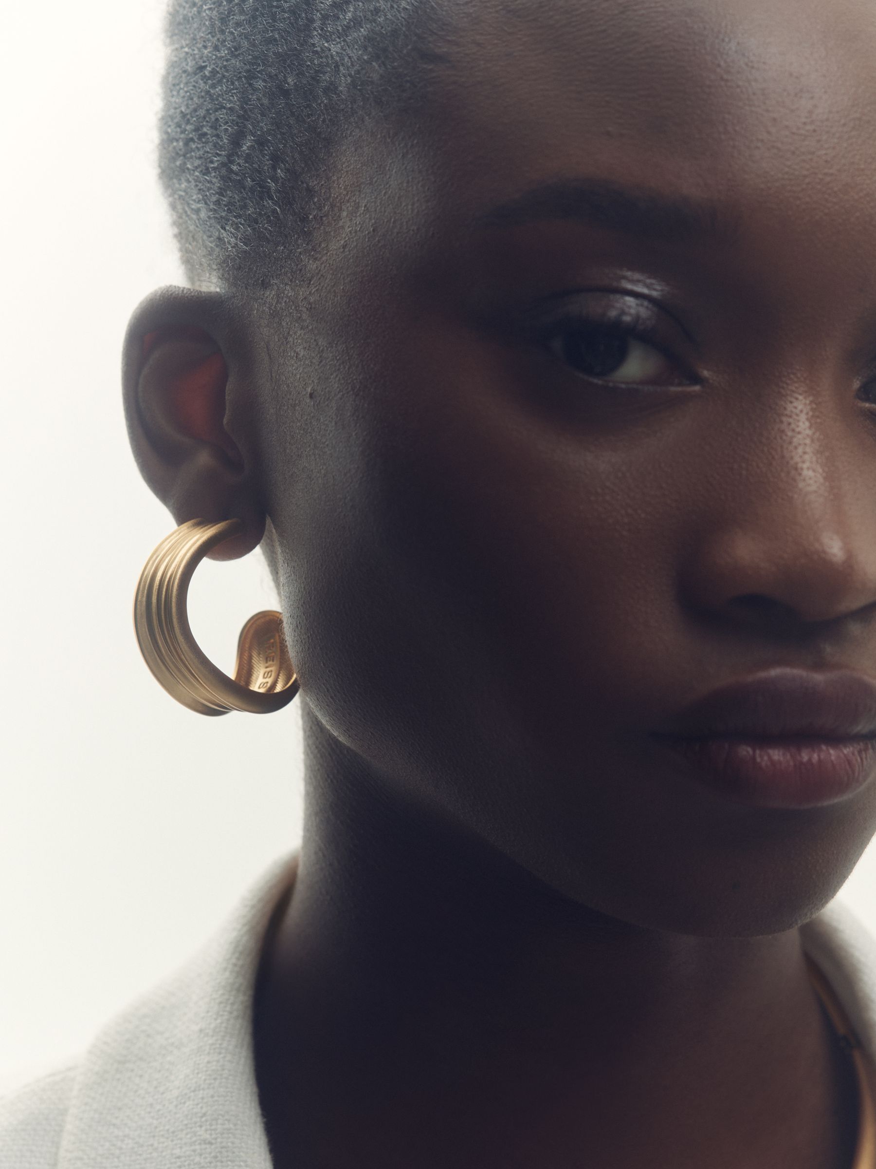 Fluid Hoop Earrings in Gold Tone