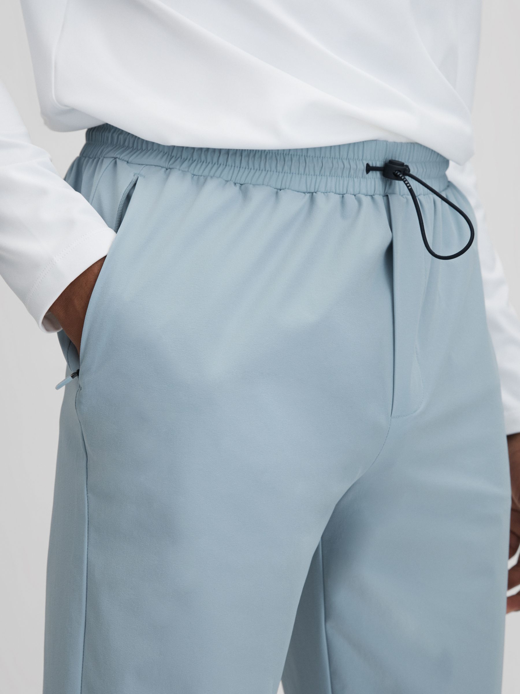Castore Water Repellent Track Joggers in Blue Silver