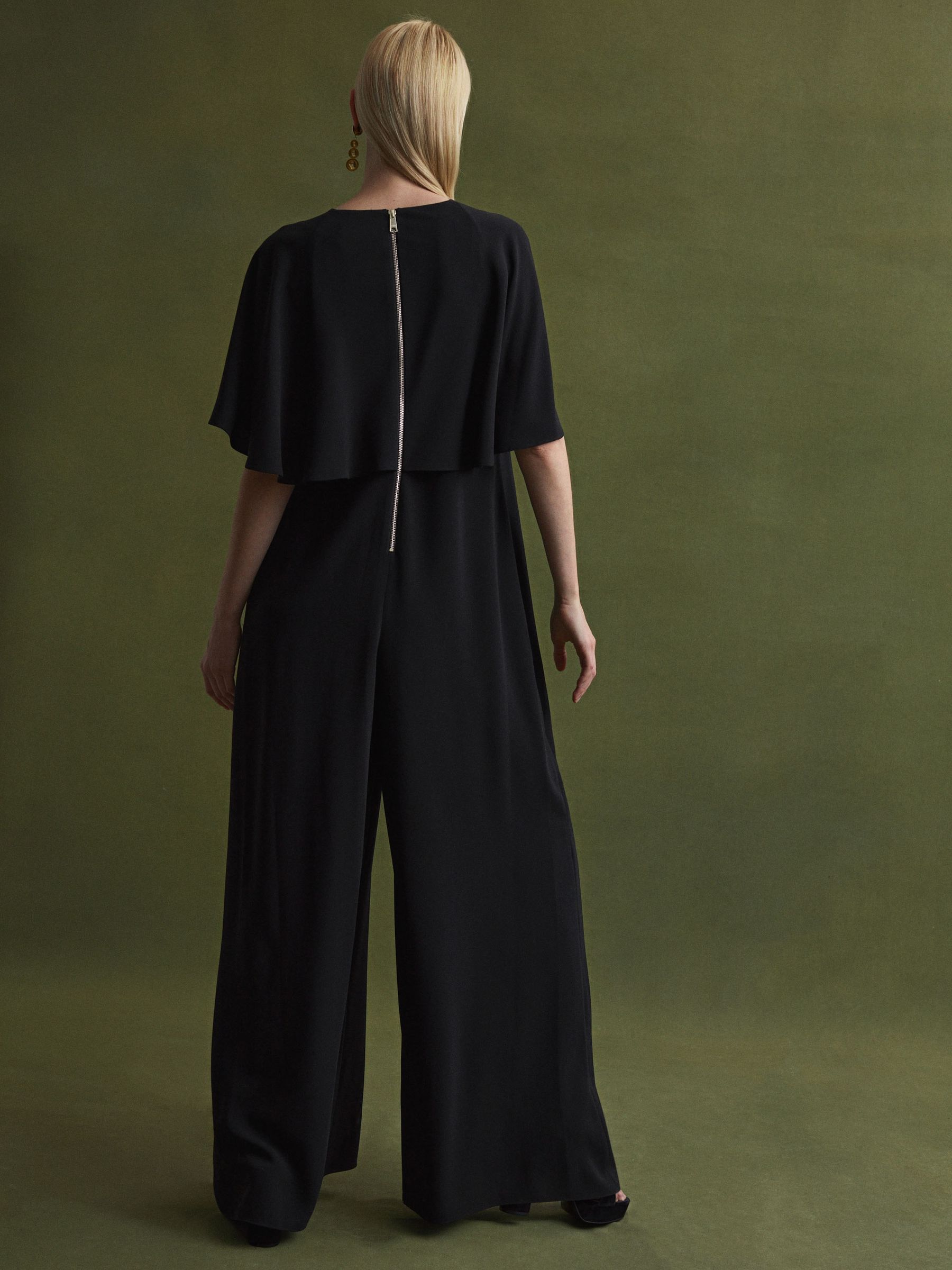 Florere Relaxed Fit Cape Sleeve Jumpsuit in Black