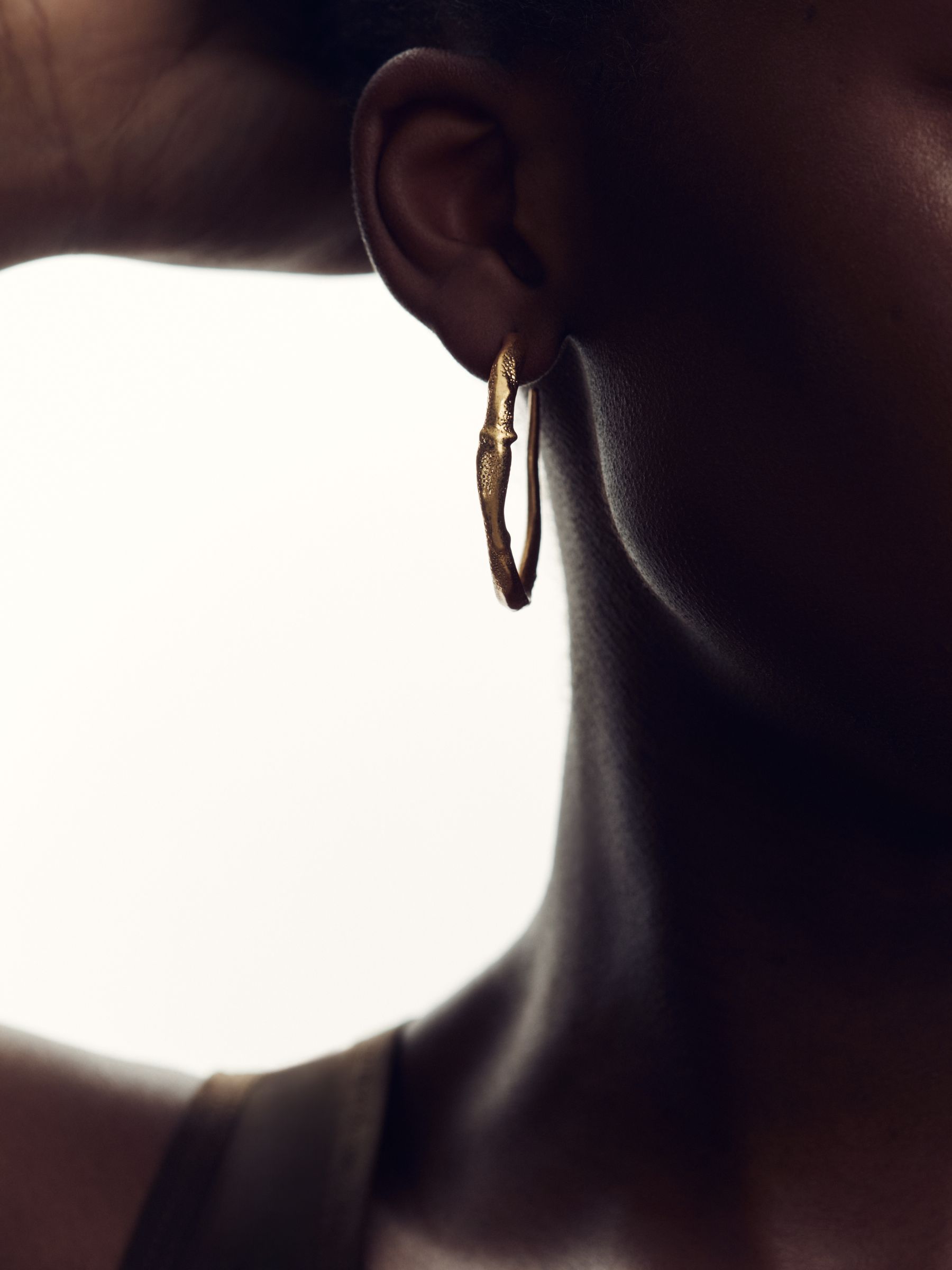 Molten Hoop Earrings in Gold Tone