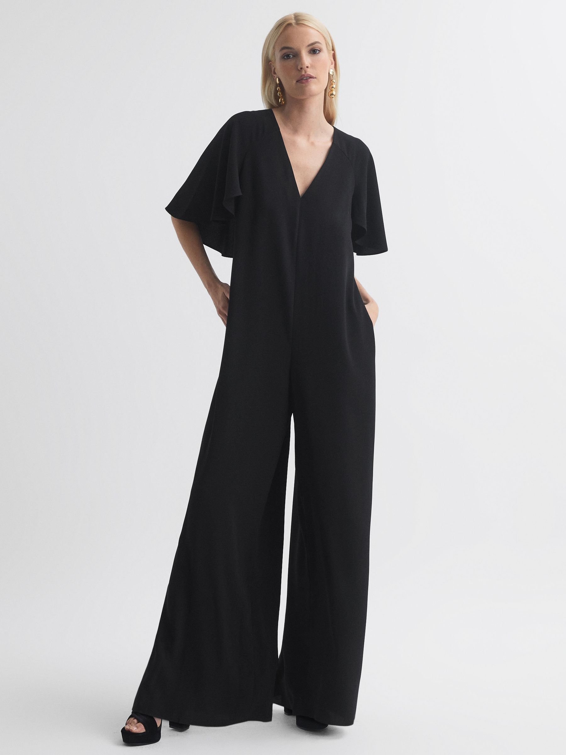Florere Relaxed Fit Cape Sleeve Jumpsuit in Black