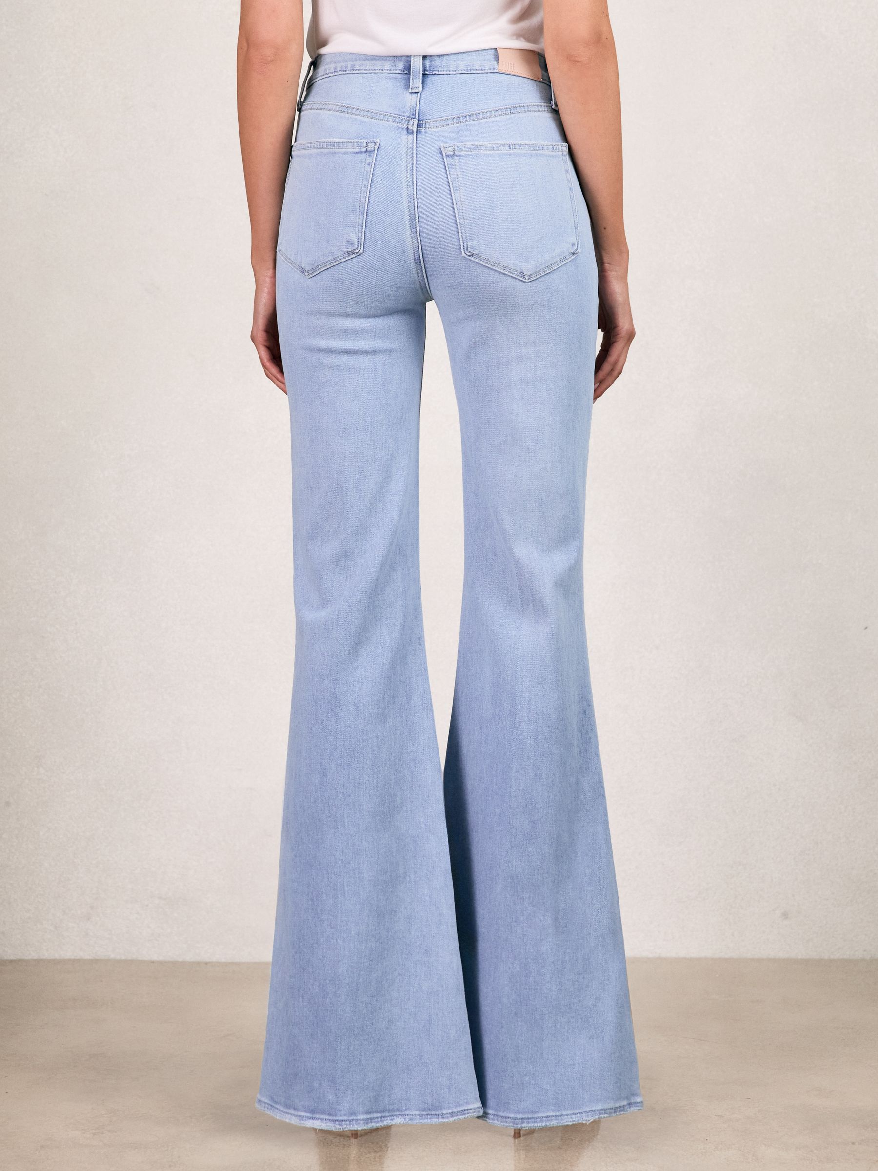 Paige Mid-Rise Flared Jeans in Light Blue