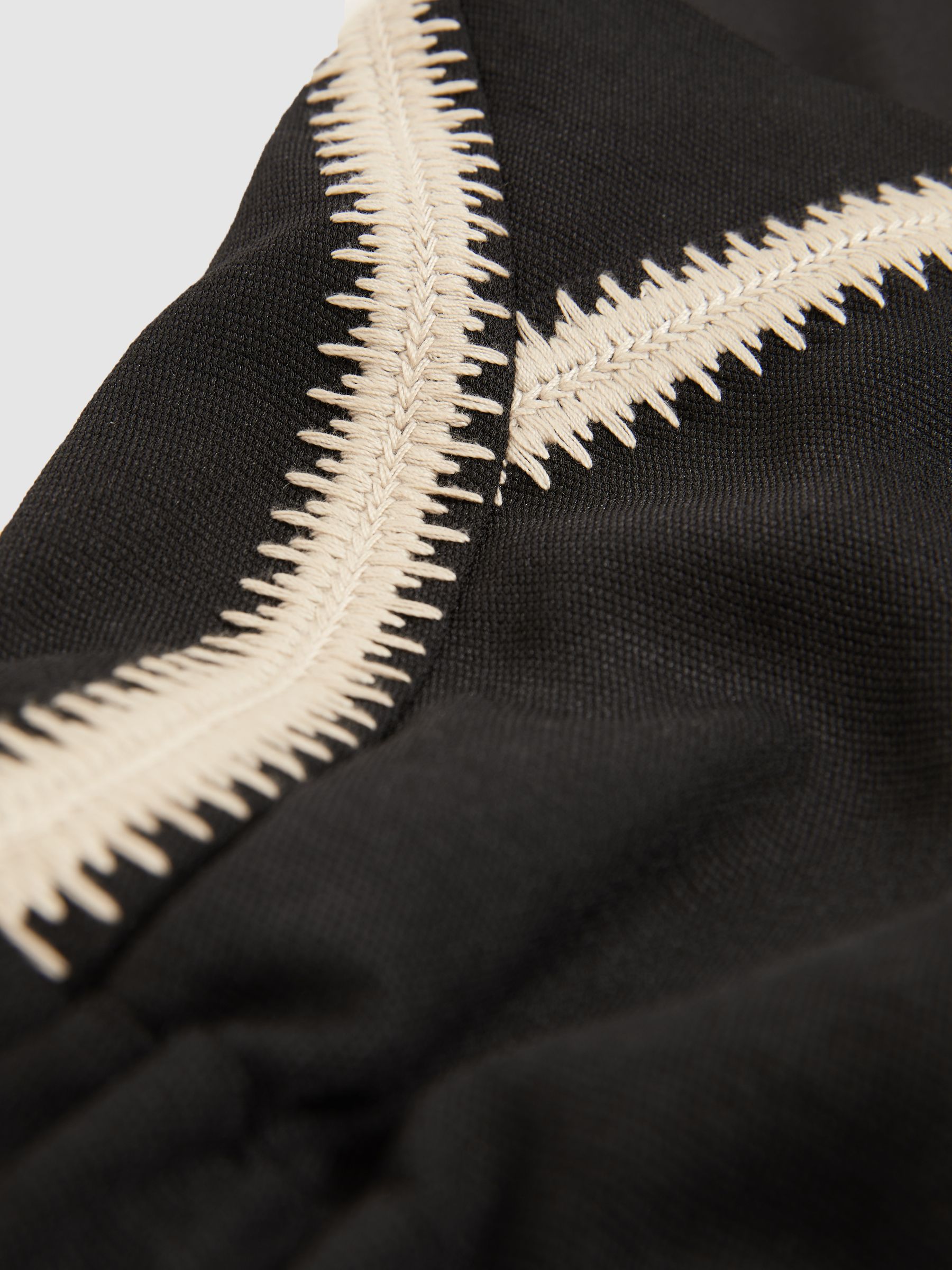 Petite Halterneck Craft Stitch Jumpsuit in Black