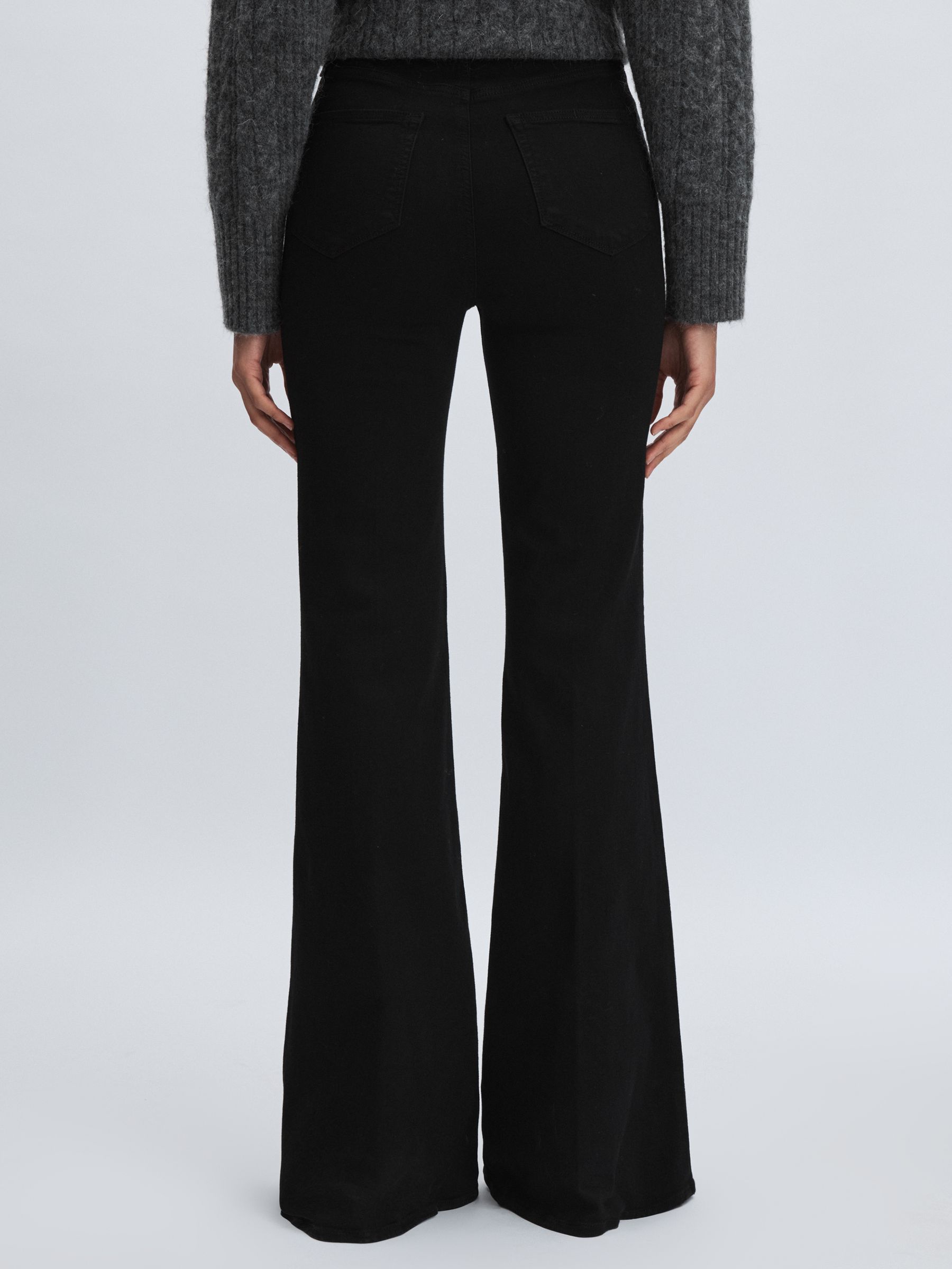 Paige Angled Waist Flared Jeans in Black