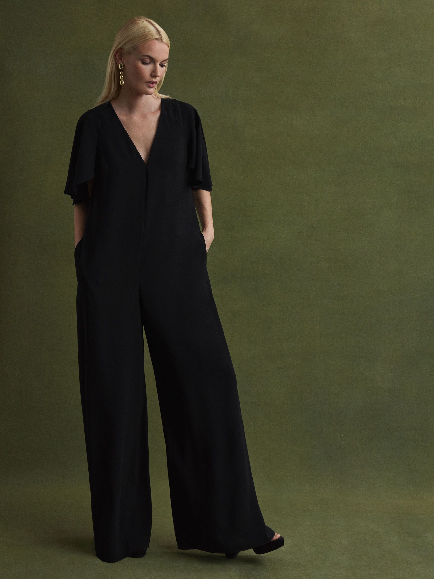 Florere Relaxed Fit Cape Sleeve Jumpsuit in Black