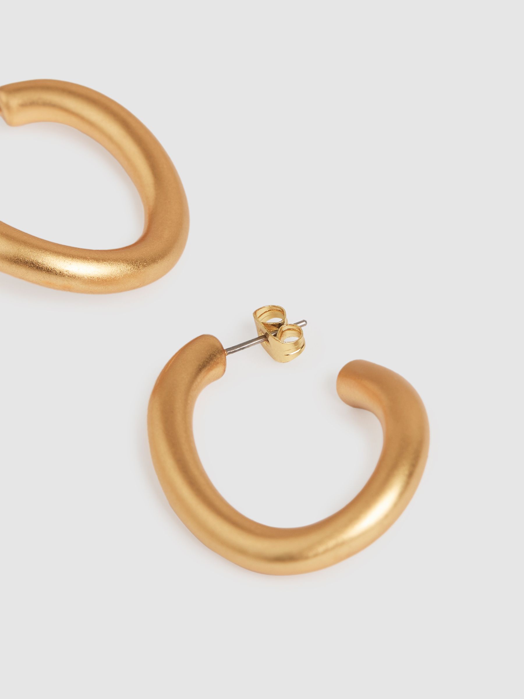 Wave Hoop Earrings in Gold Tone