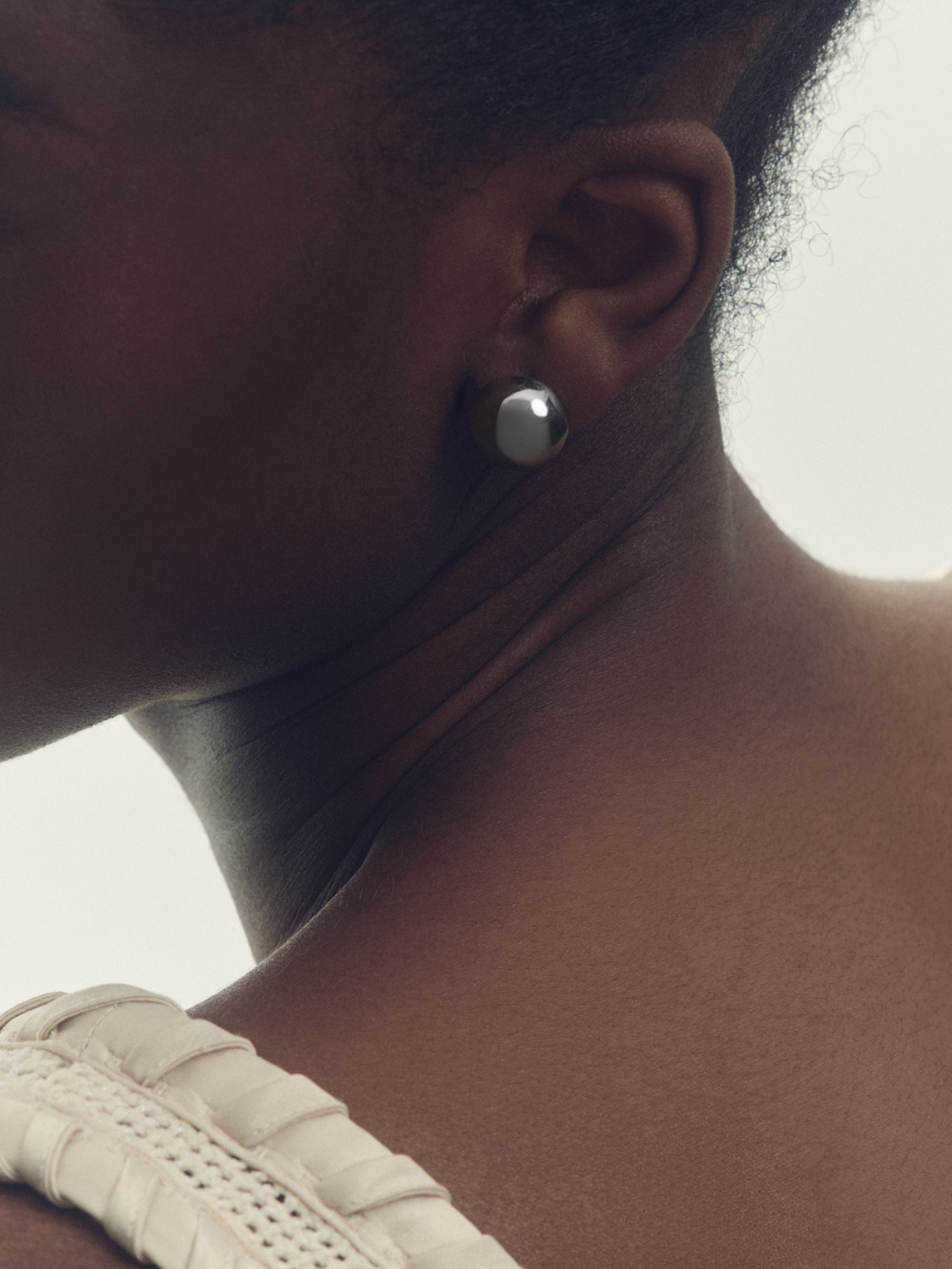 Polished Ball Huggie Earrings in Silver Tone