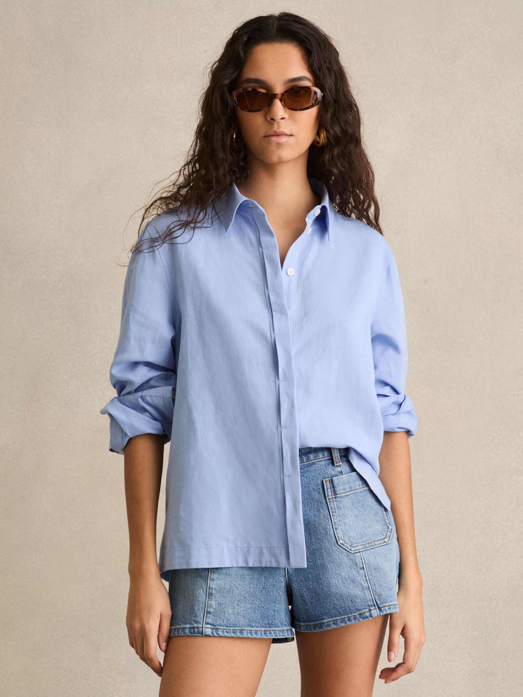 Mid-Rise Patch Pocket Denim Shorts in Mid Blue